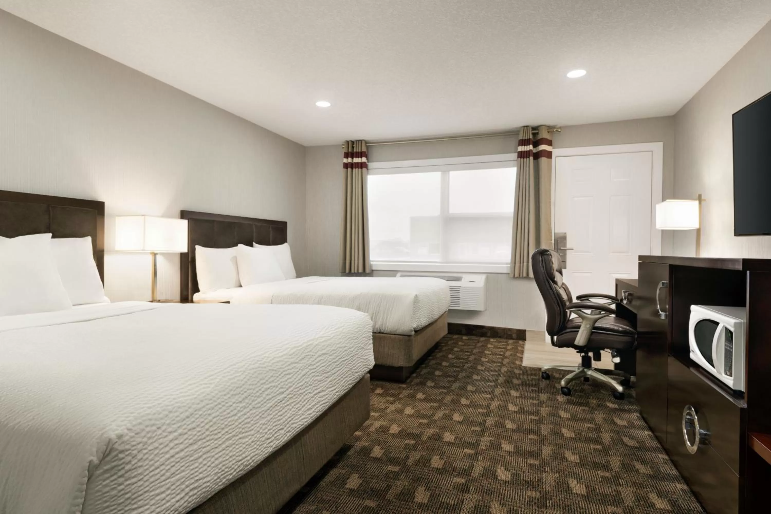 Photo of the whole room, Bed in Days Inn by Wyndham Wainwright