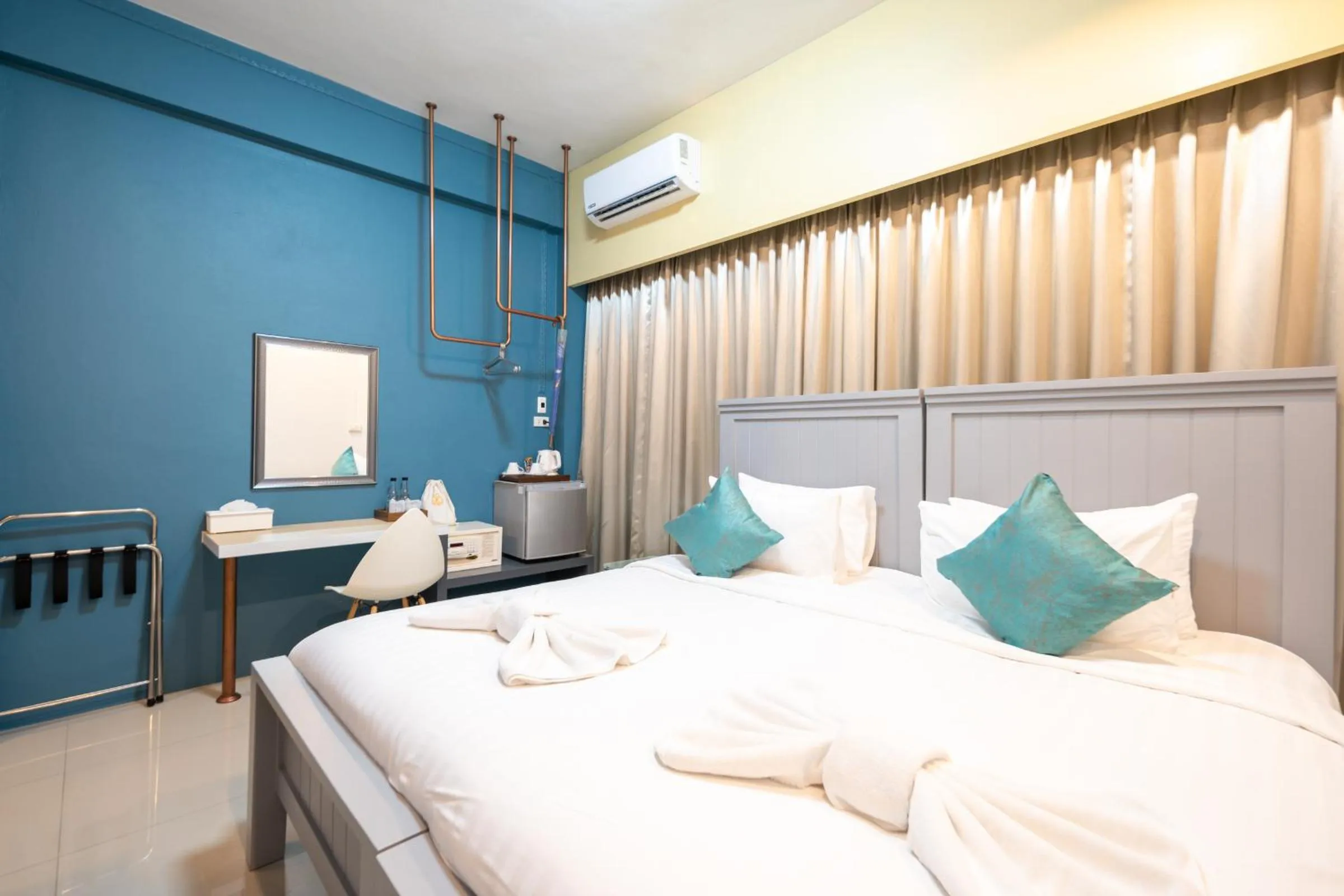 Bed in The Iconic Hotel Ranong