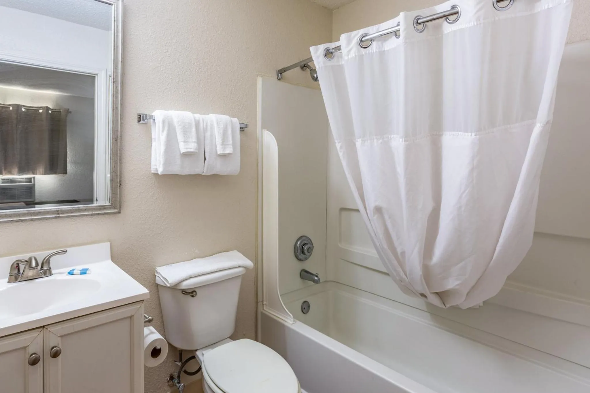 Bathroom in HomeTowne Studios by Red Roof Gainesville, GA