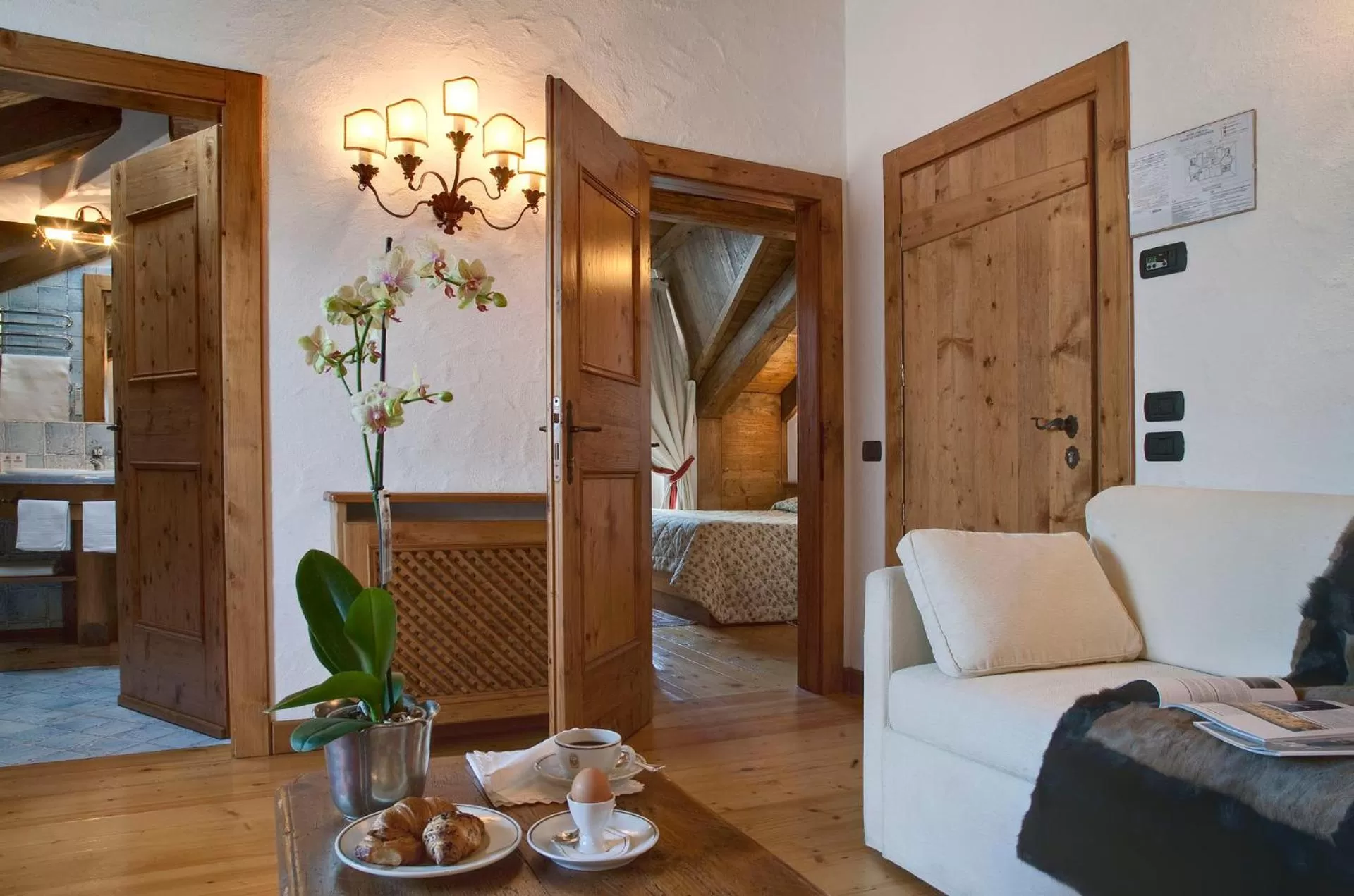 Bed, Seating Area in Hotel Cortina