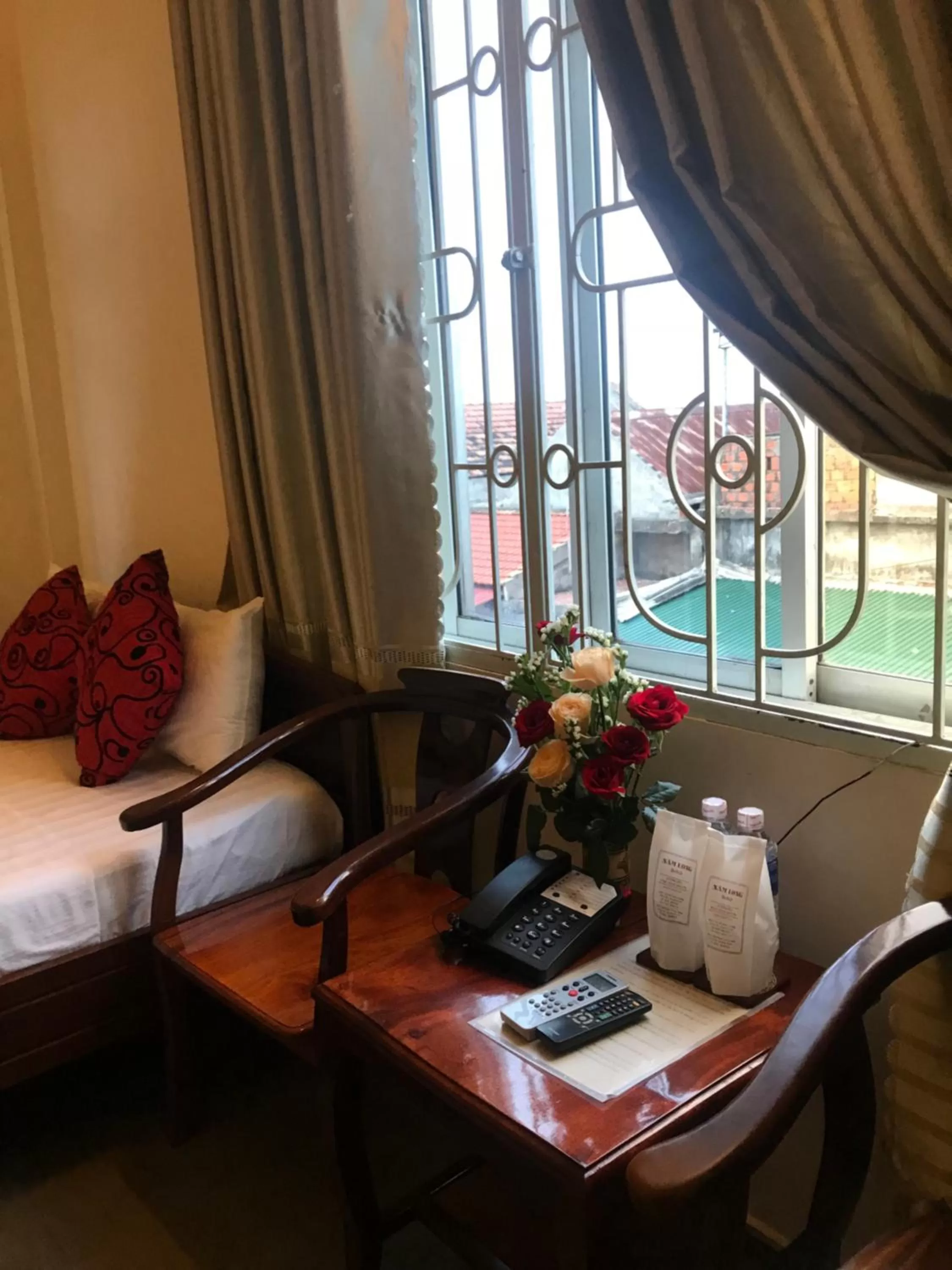 Seating area, Bed in Nam Long Hotel