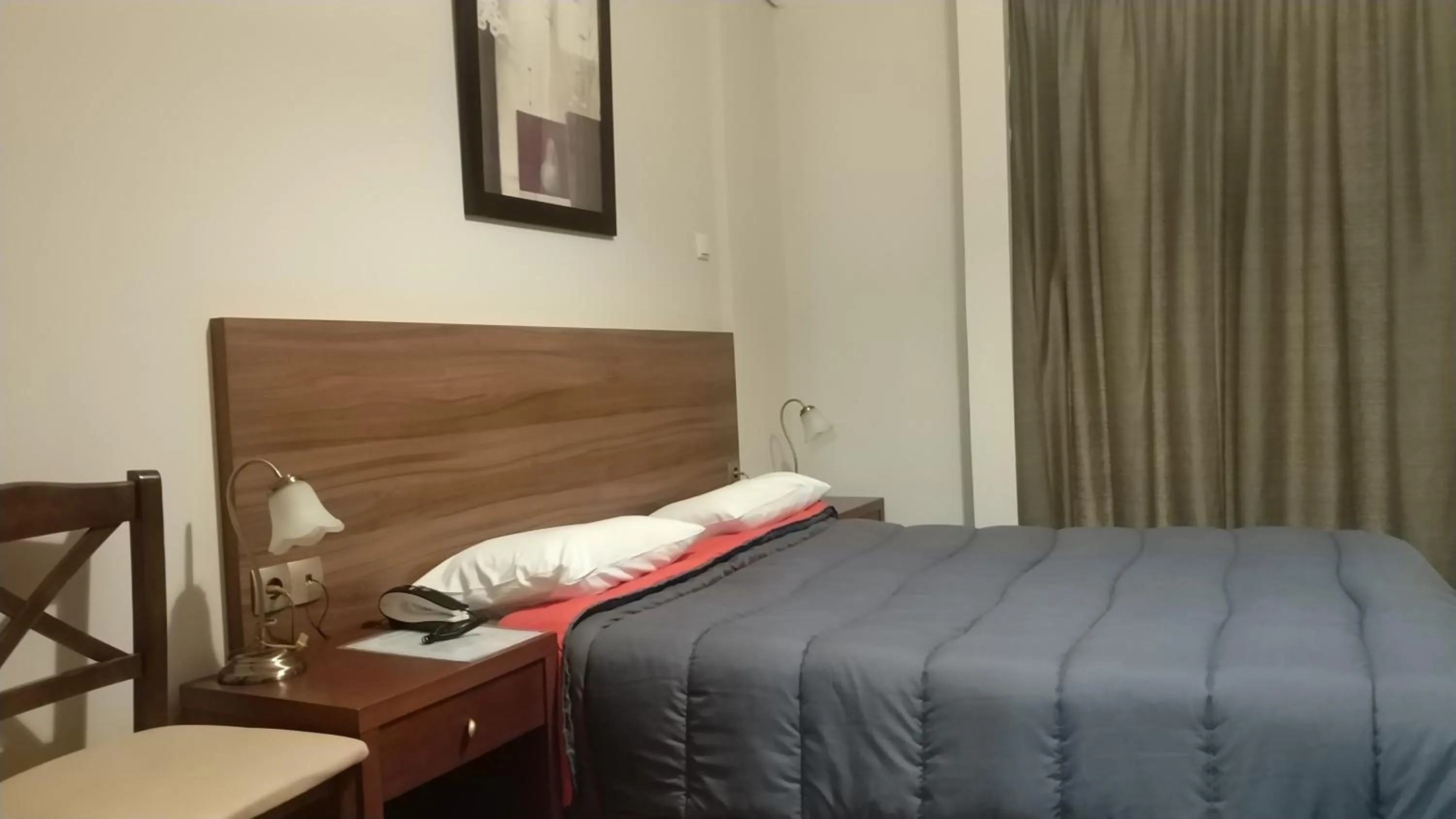 Bed in Ambrosia Suites