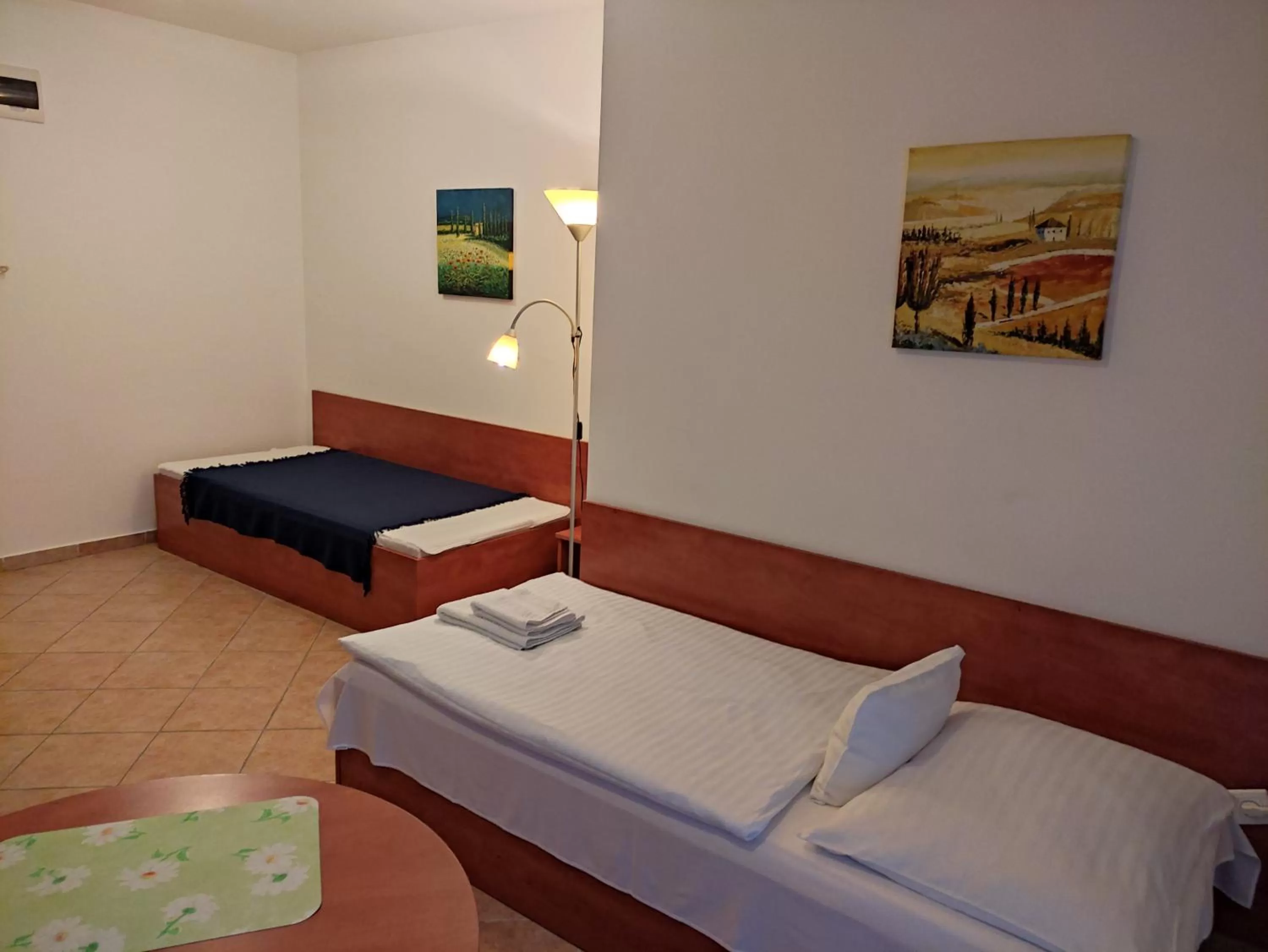 Bed in Szent Kristóf Apartmanhotel