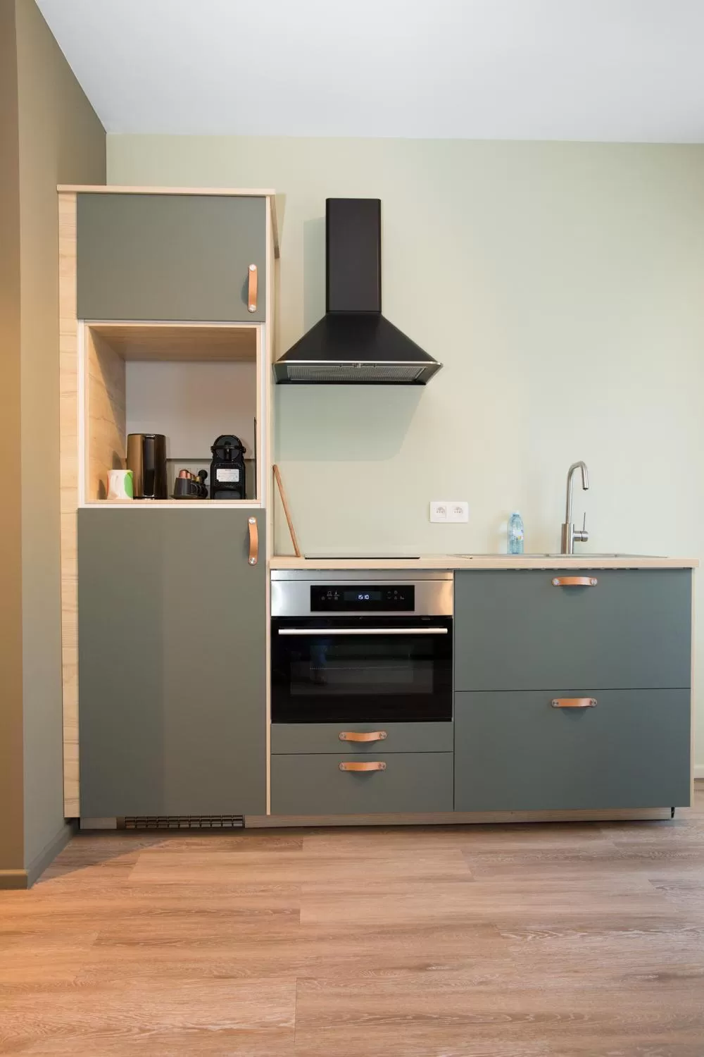 Kitchen or kitchenette in Appart hôtel En Ville