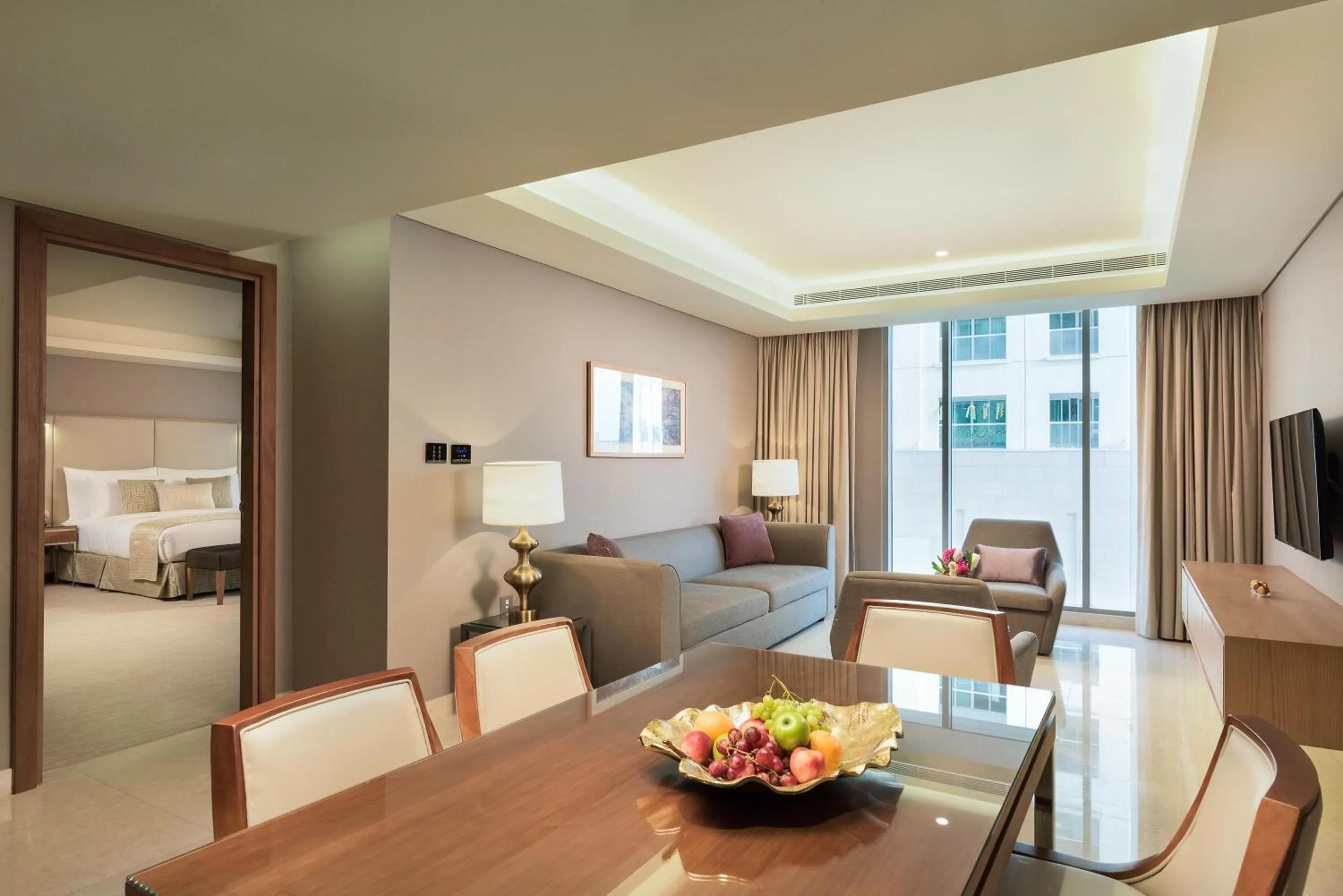 Living room, Bed in Grand Millennium Muscat