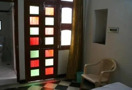 Seating area, Bed in Udai Haveli Guest House