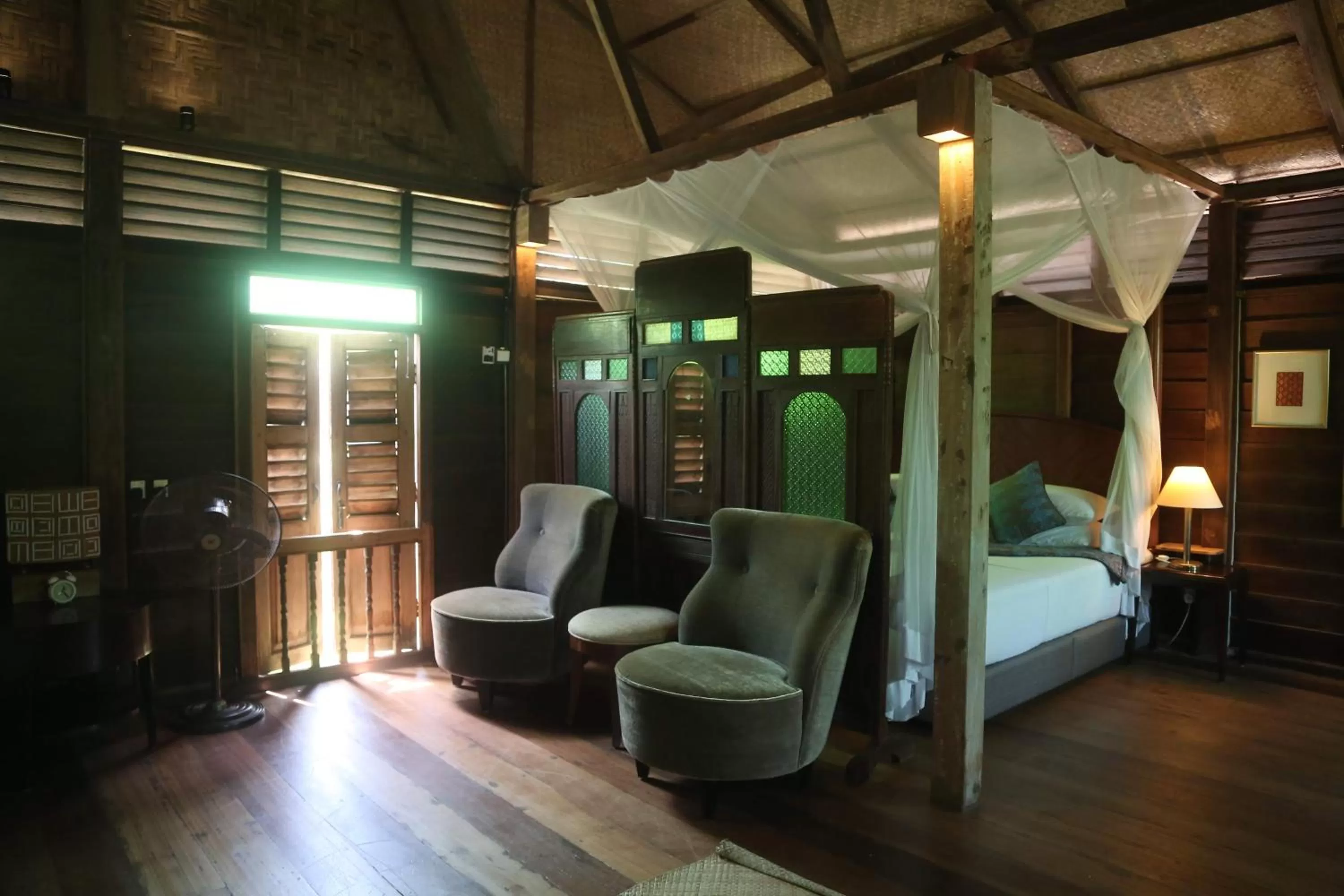 Bed in Kunang Kunang Heritage Villas