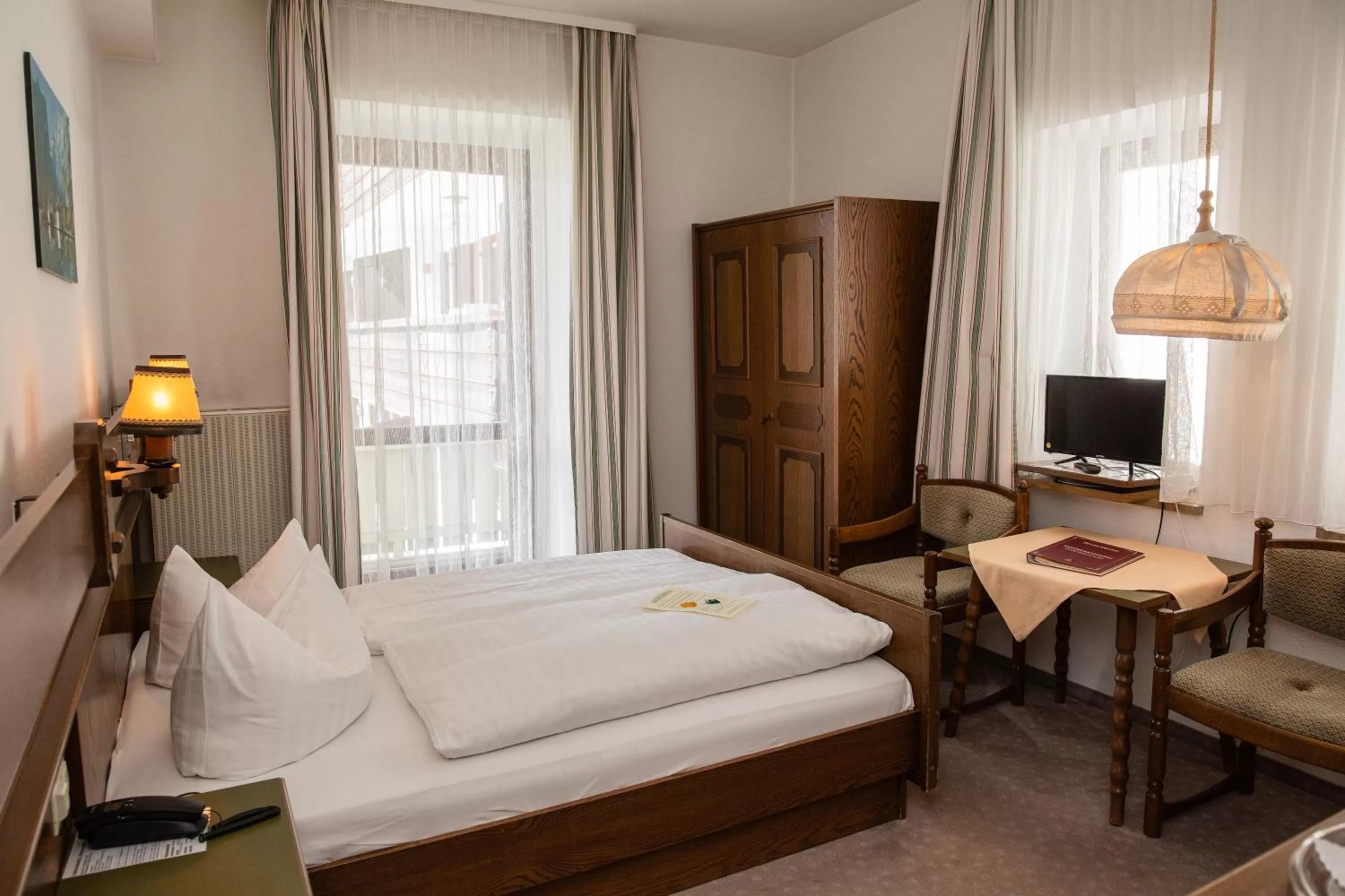 Bed in Hotel Vier Jahreszeiten