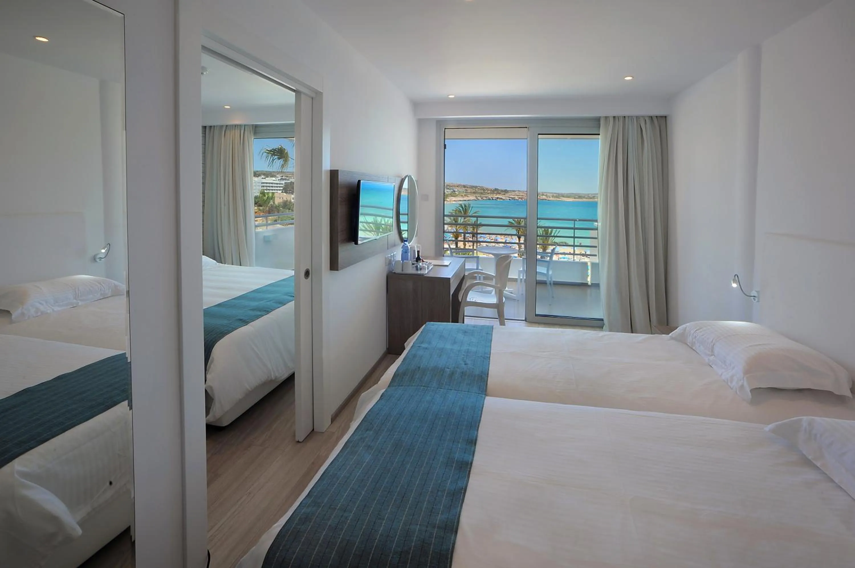 Bed in Okeanos Beach Boutique Hotel