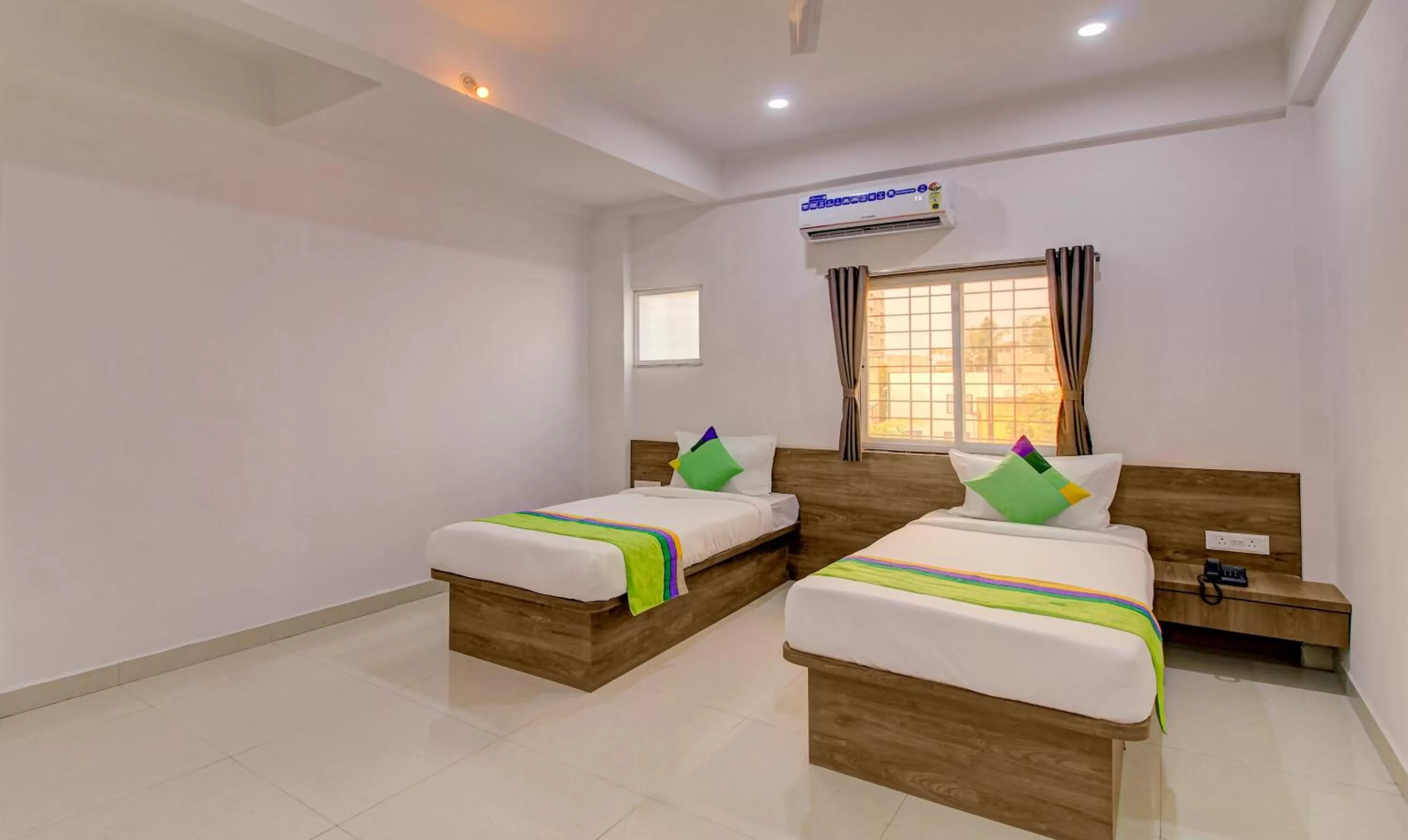 Bed in Treebo Trend White House