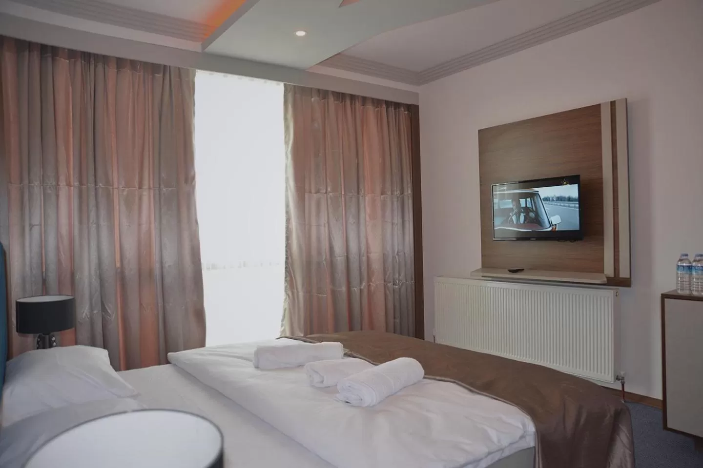 Bed in TEVETOGLU HOTEL