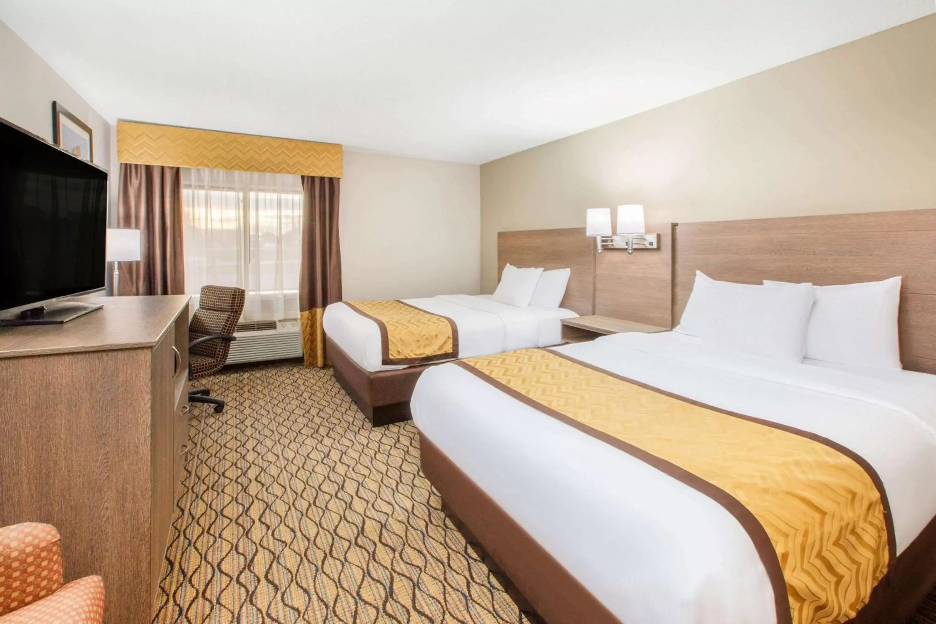 Queen Room with Two Queen Beds - Non-Smoking in Baymont by Wyndham Grand Rapids Airport Queen Room with Two Queen Beds - Non-Smoking in Baymont by Wyndham Grand Rapids Airport