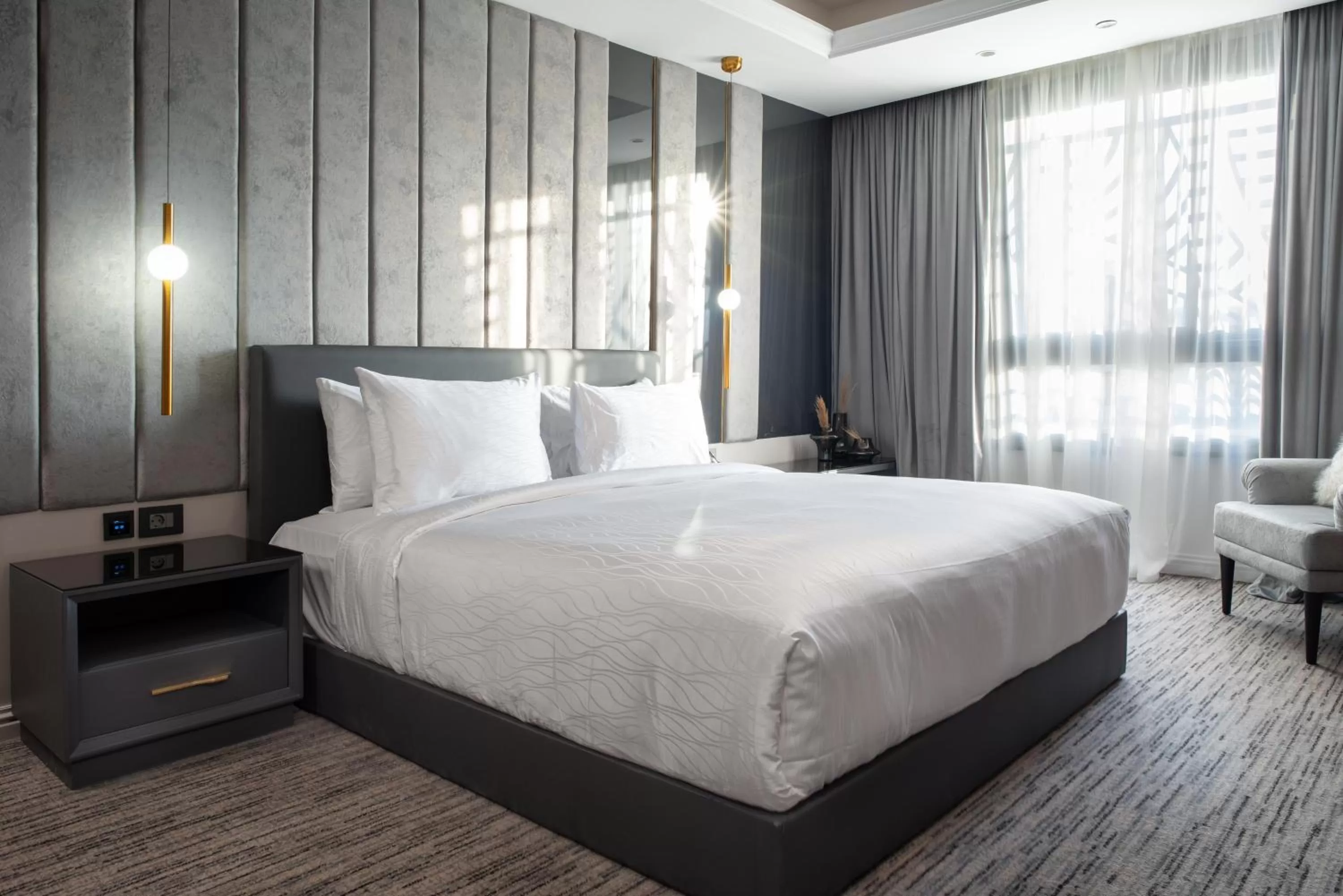 Photo of the whole room, Bed in Triumph Luxury Hotel