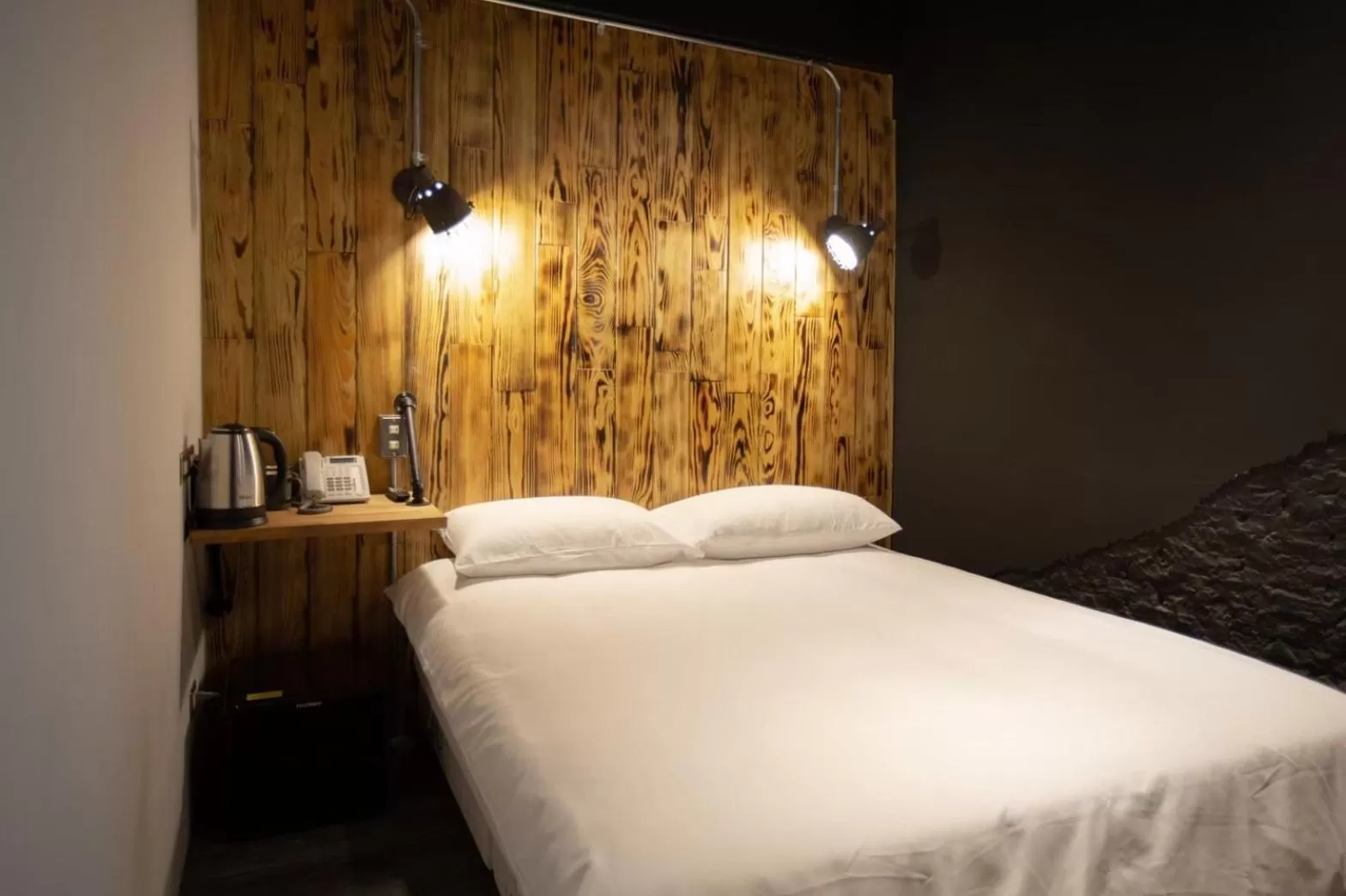 Bed in The Rooms Inn