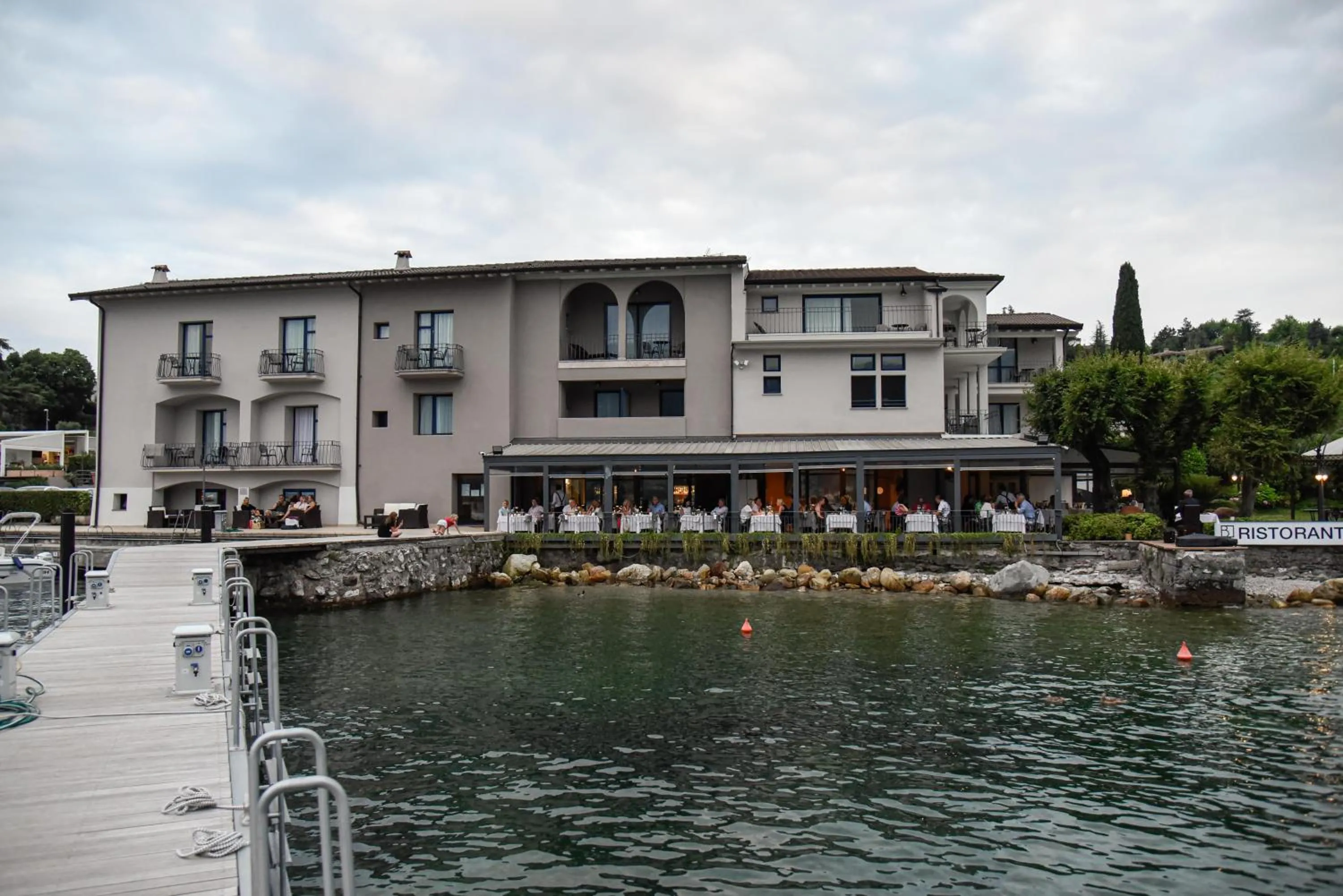 Property building in Bella Hotel & Restaurant with private dock for mooring boats