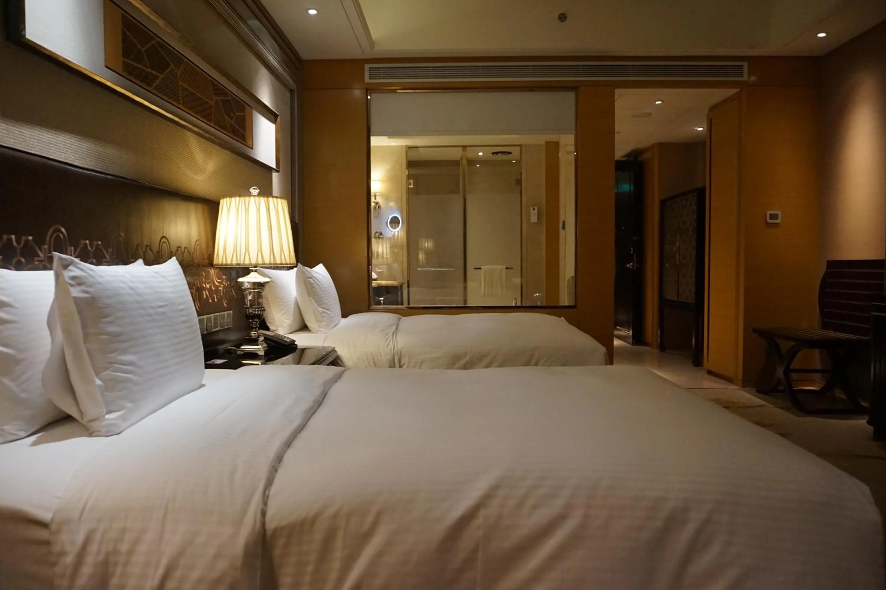 Bed in Wanda Realm Harbin Hotel