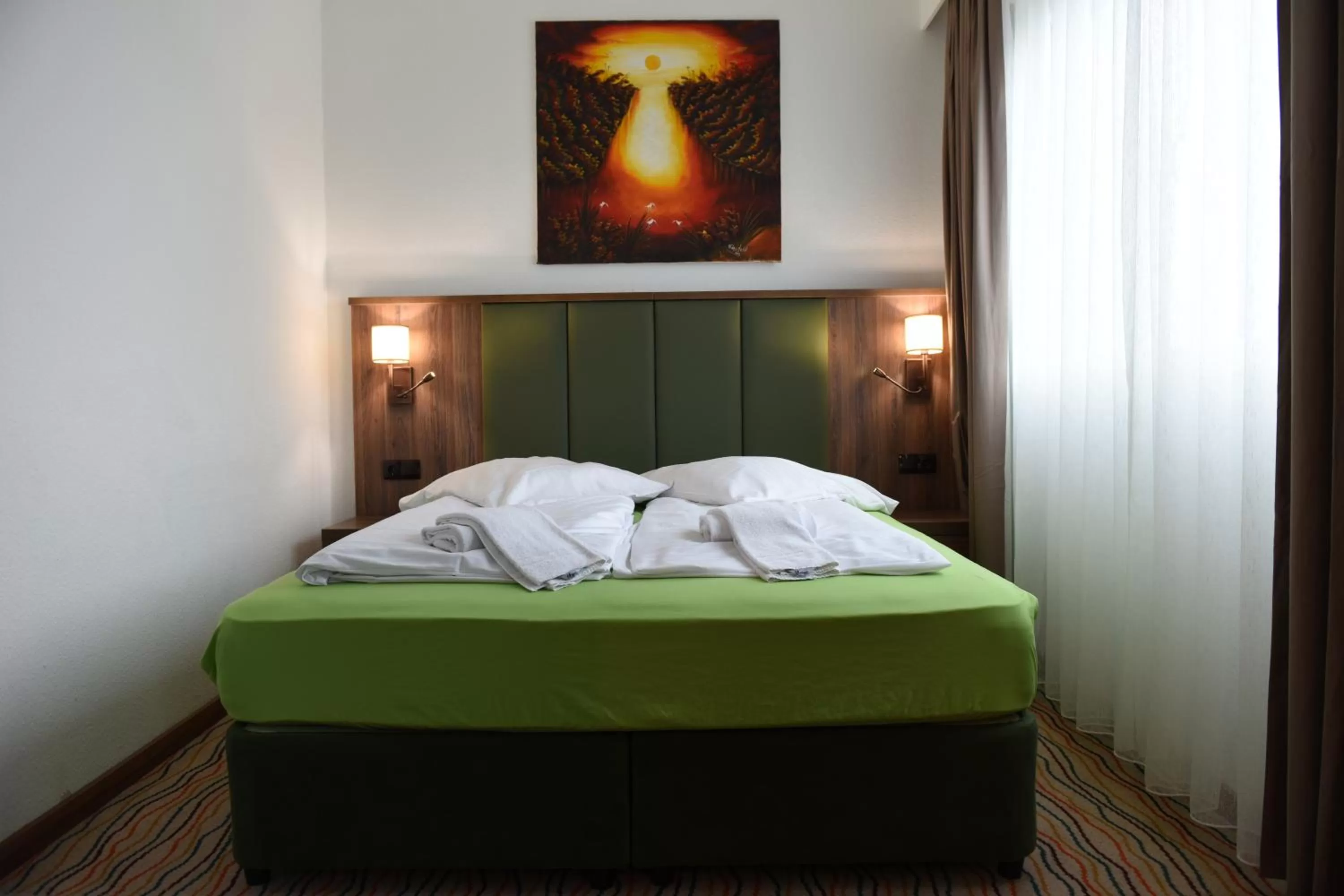 Bed in Hotel Olive Inn