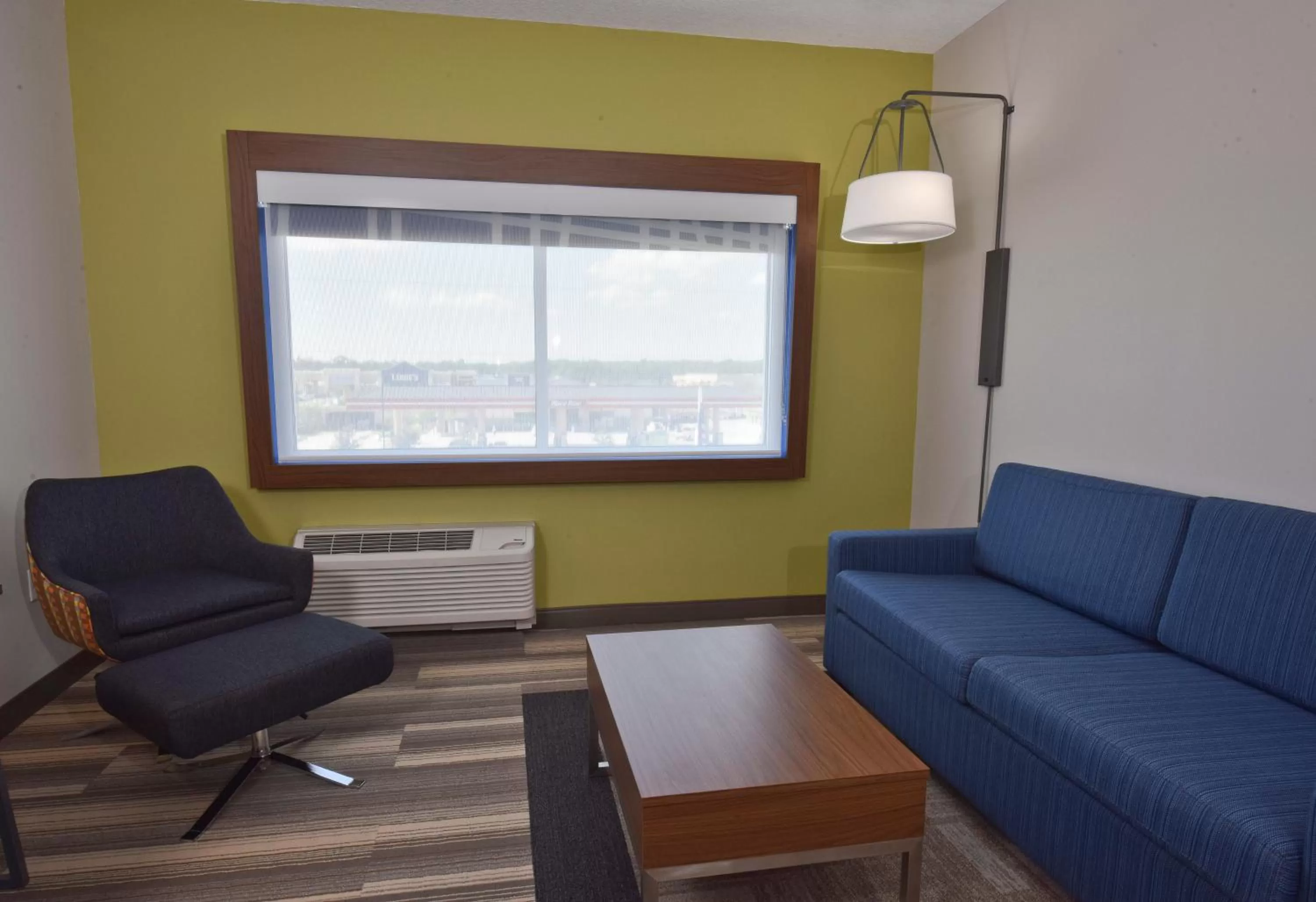 Living room in Holiday Inn Express & Suites - Orlando - Southeast by IHG
