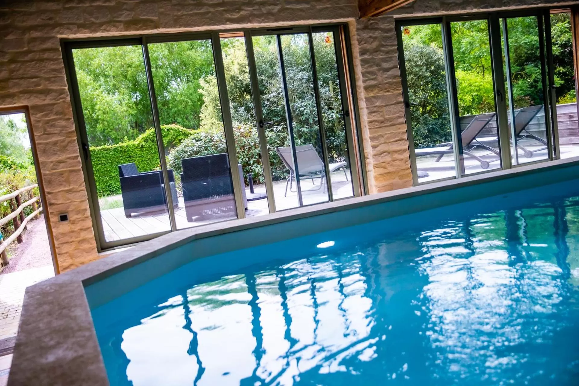 Swimming pool in La Ferme de l'Oudon & SPA