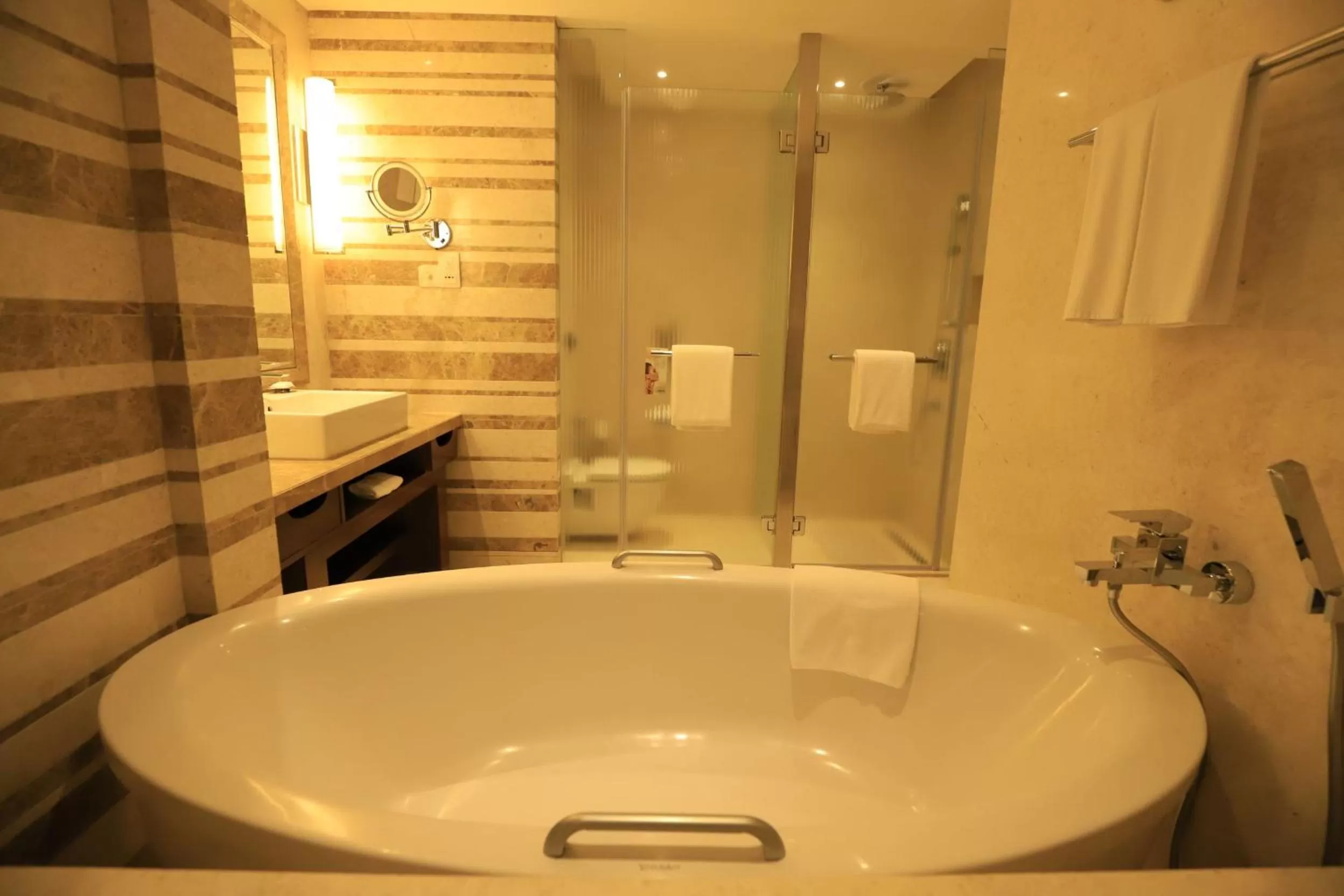Bathroom in Crowne Plaza New Delhi Okhla by IHG