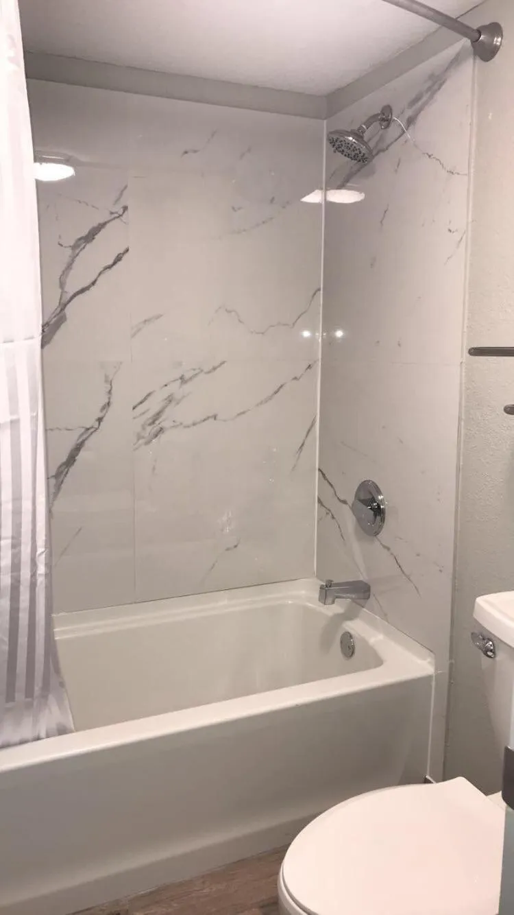 Toilet in All Seasons Inn & Suites