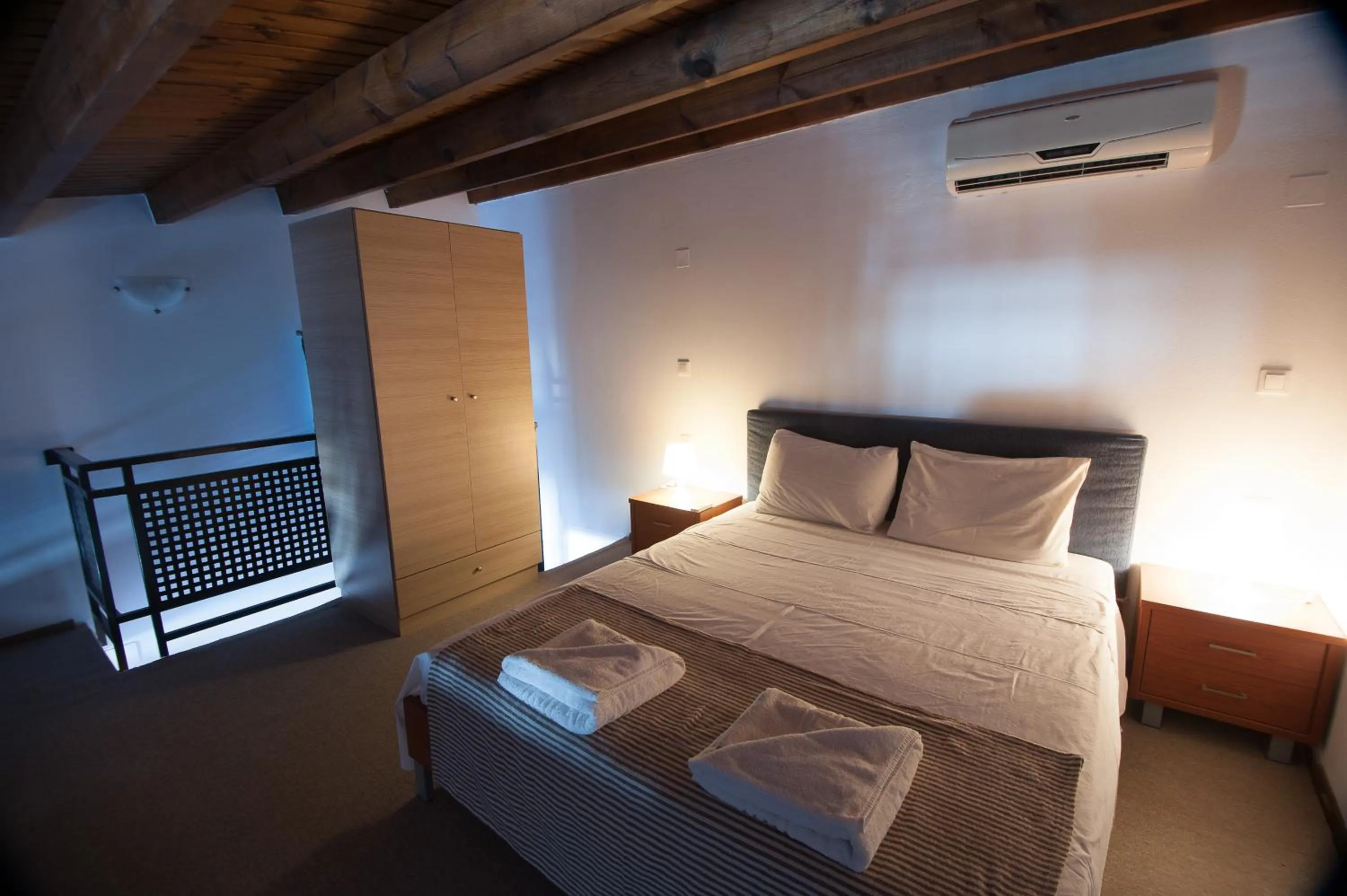 Bed in Elounda Sunrise Apartments