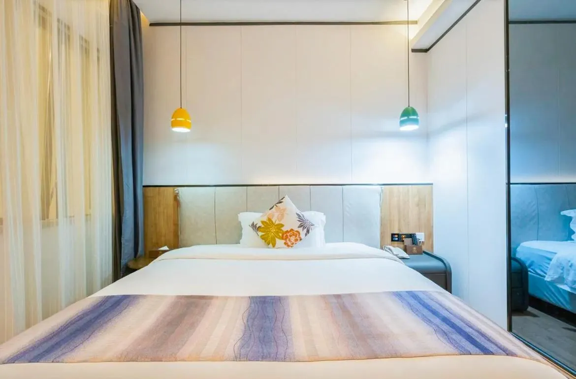 Bedroom in Guangzhou Nuomo International Hotel-Canton Fair Free Shuttle Bus