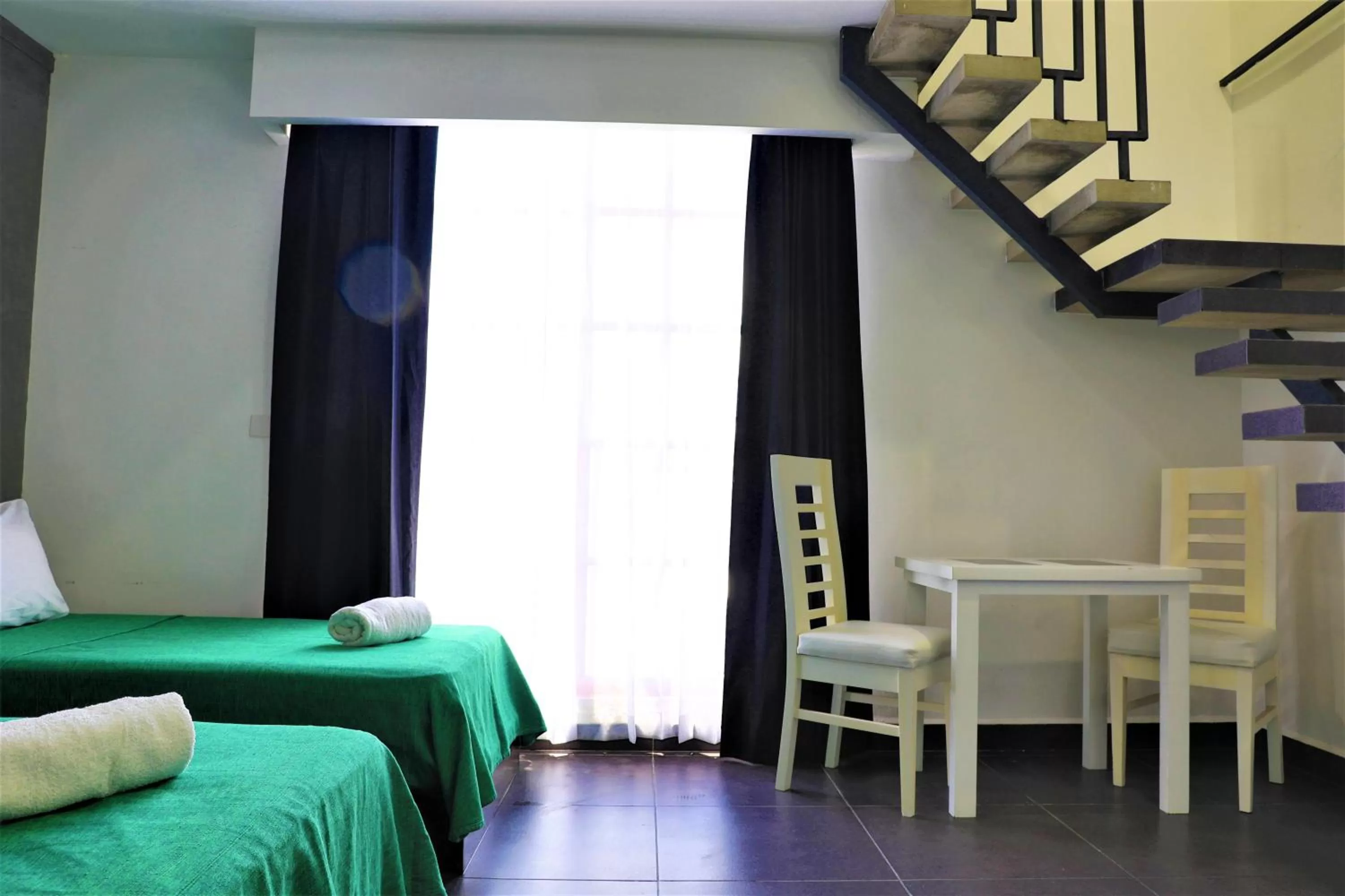 Photo of the whole room, Bed in Hotel Colonial Playa del Carmen