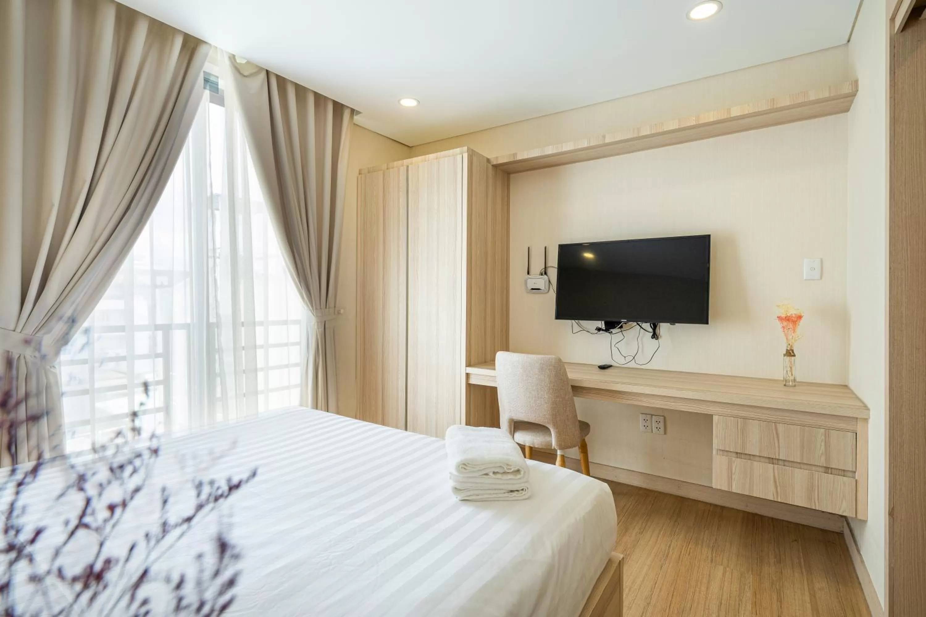 TV/Entertainment Center in Luxy Park Hotel & Apartments - Notre Dame