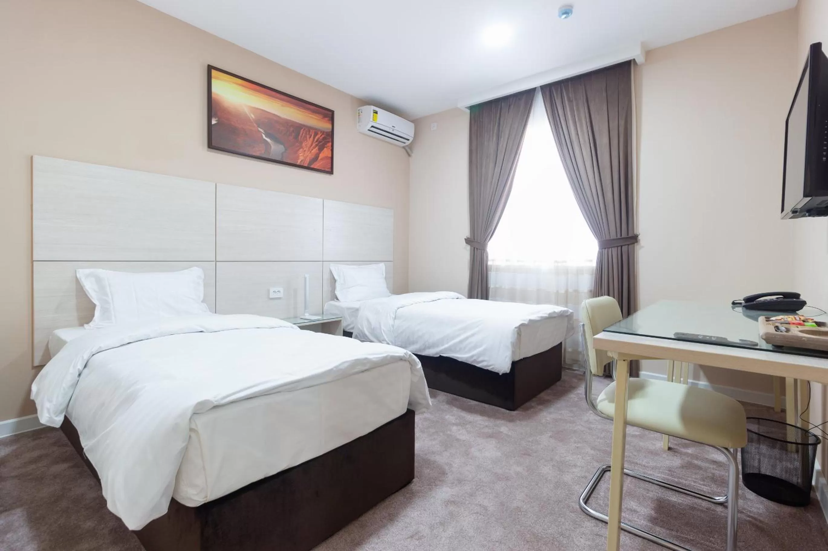 Bed in Musafir Hotel