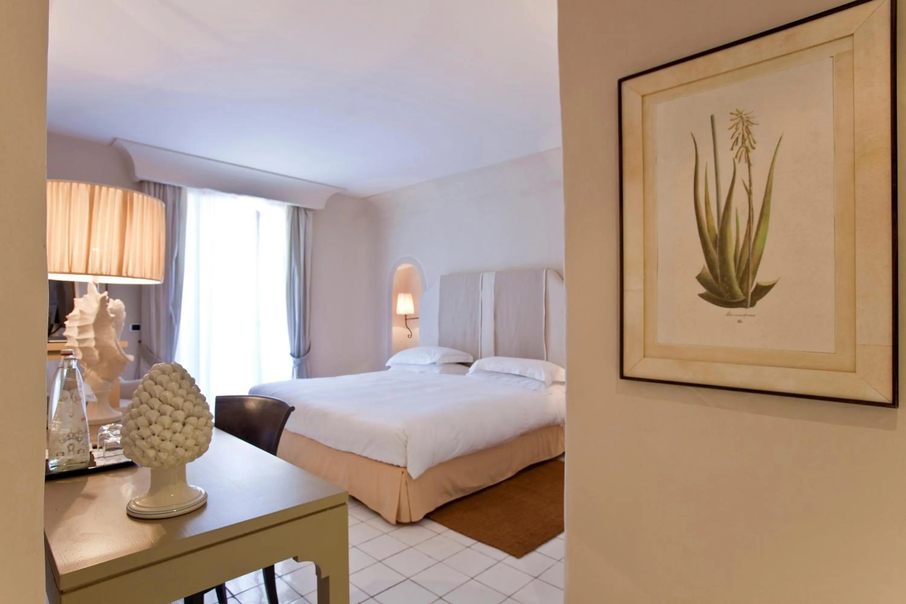 Bed in Therasia Resort Sea and SPA - The Leading Hotels of the World