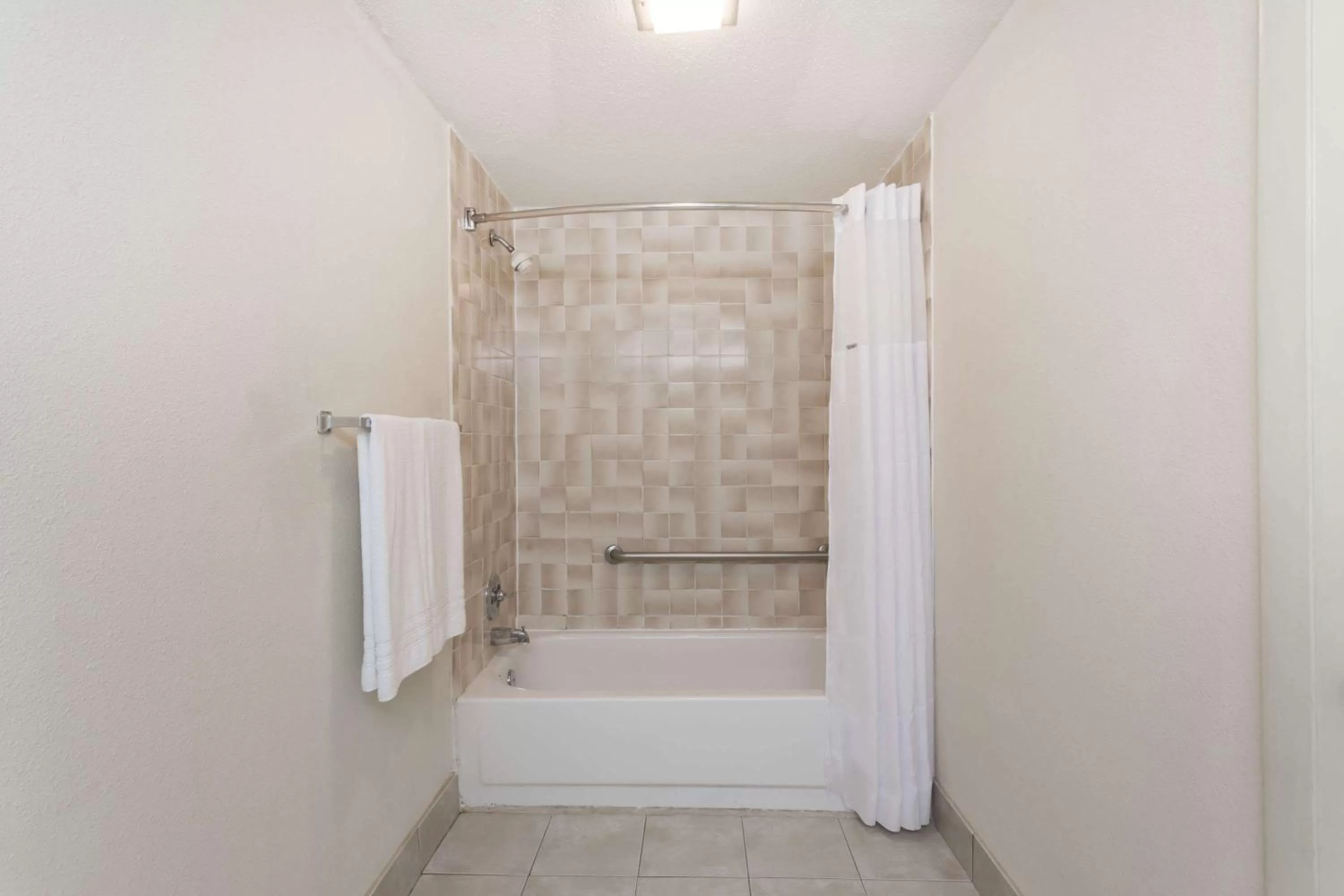 Bathroom in Days Inn by Wyndham Winston Salem North