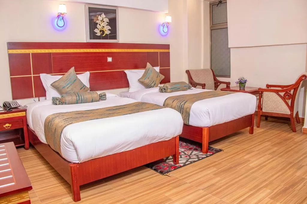 Seating area, Bed in Vickmark Hotel