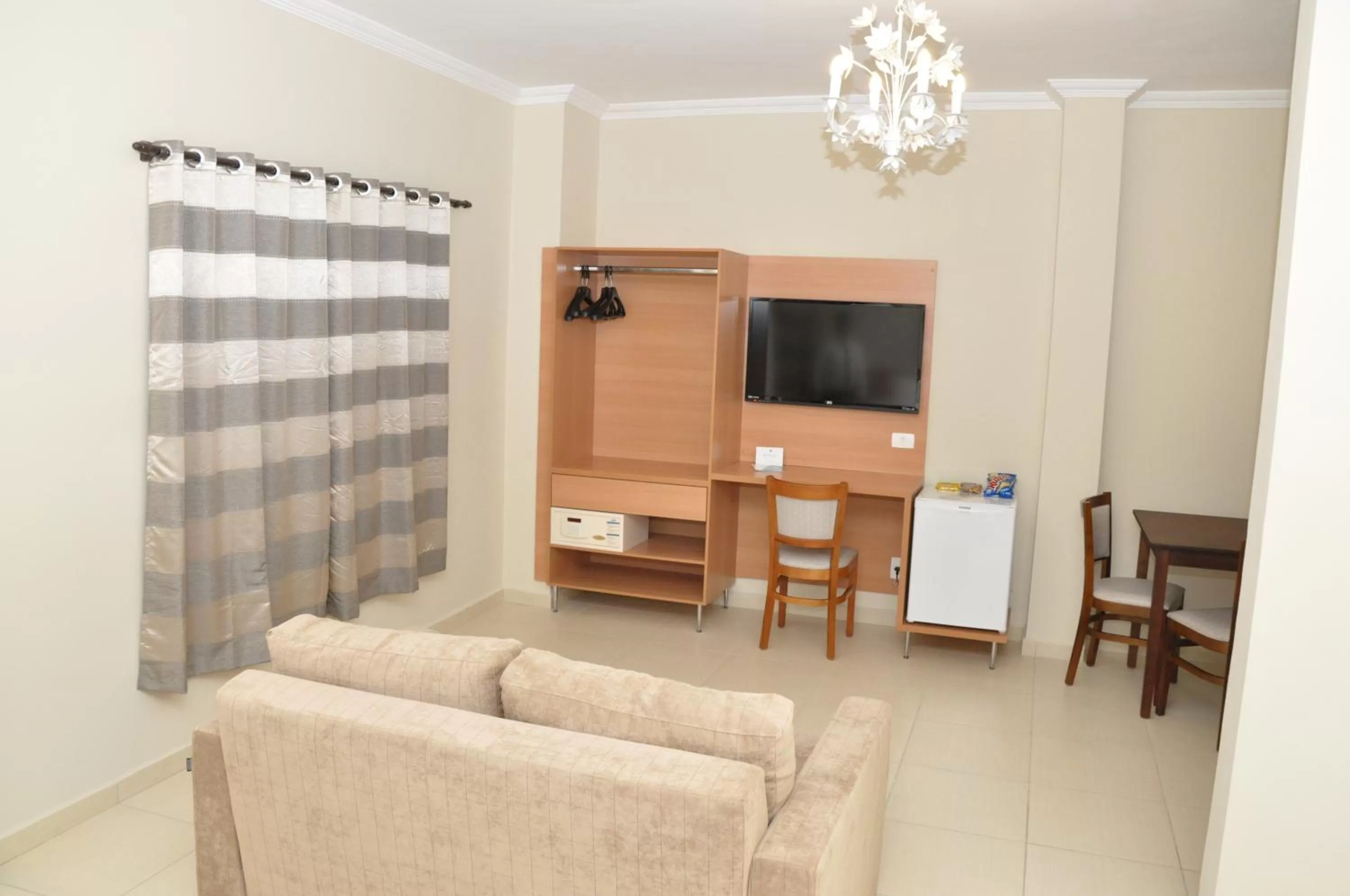 TV and multimedia, Seating Area in Lotus Hotel - à 6 km do Santuário de Aparecida-SP