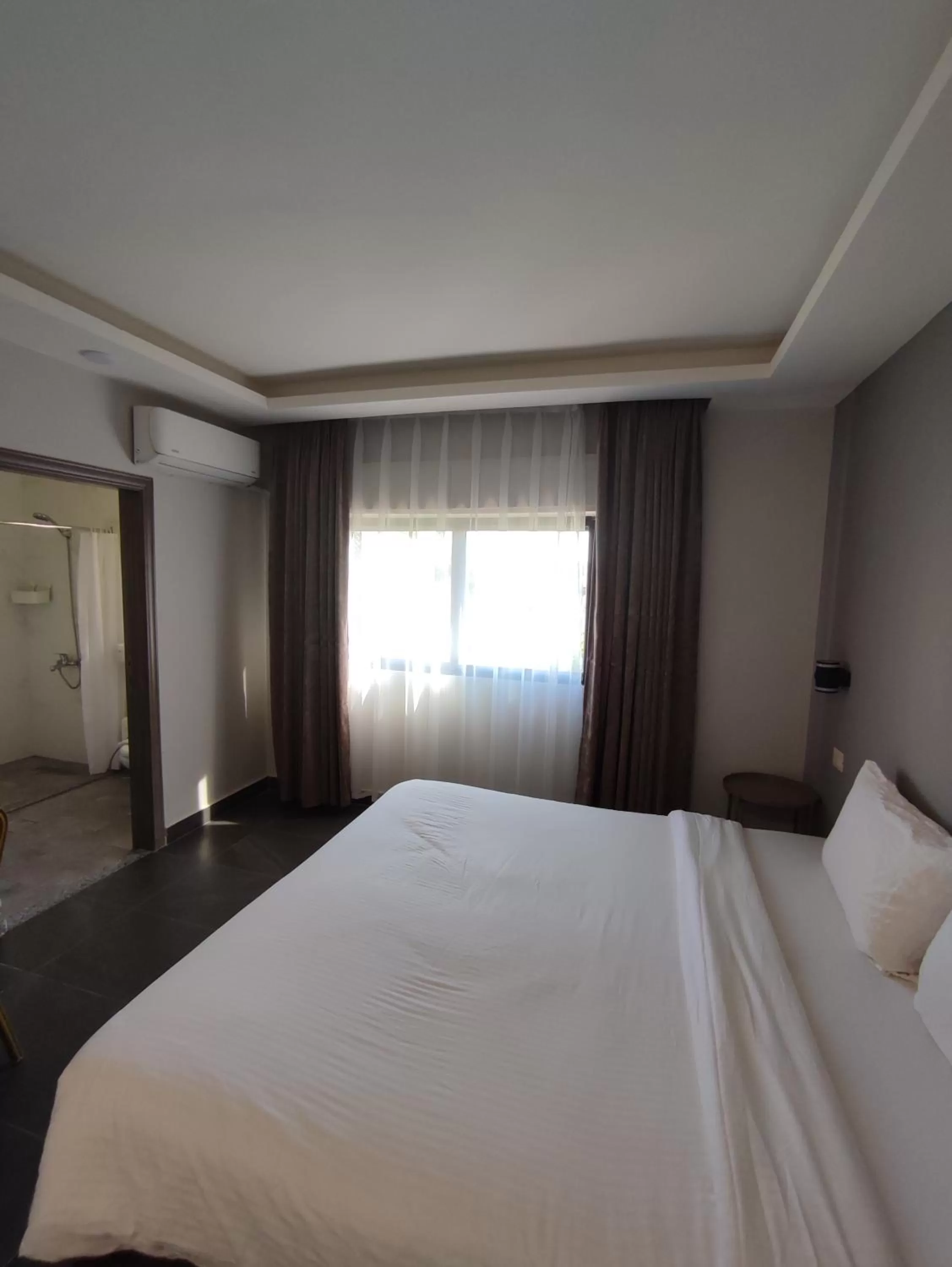 Bed in Black Iris Hotel