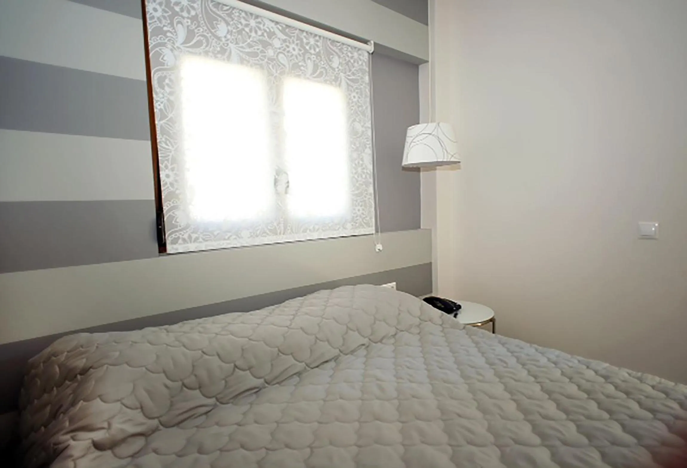 Bed in Dimitra Boutique Hotel