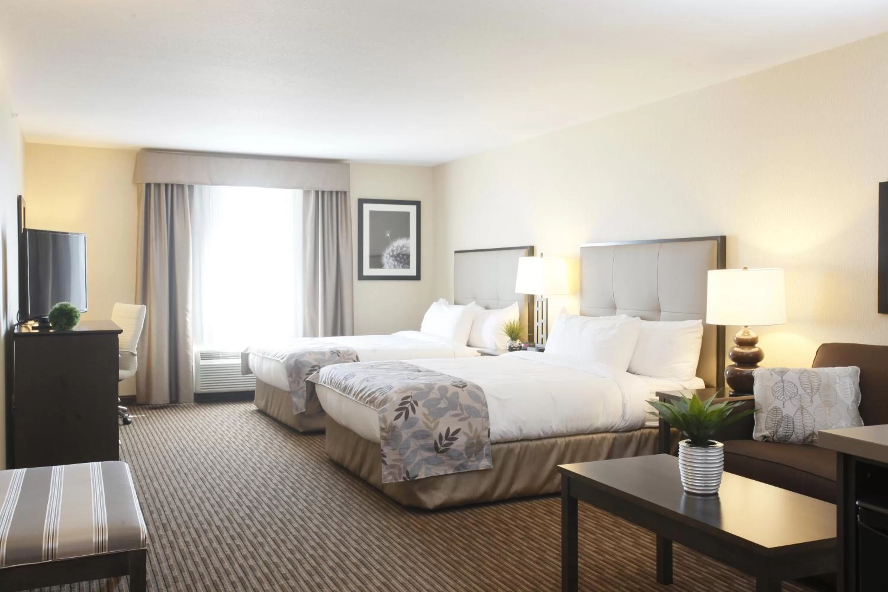 Bedroom, Bed in Pomeroy Inn & Suites at Olds College