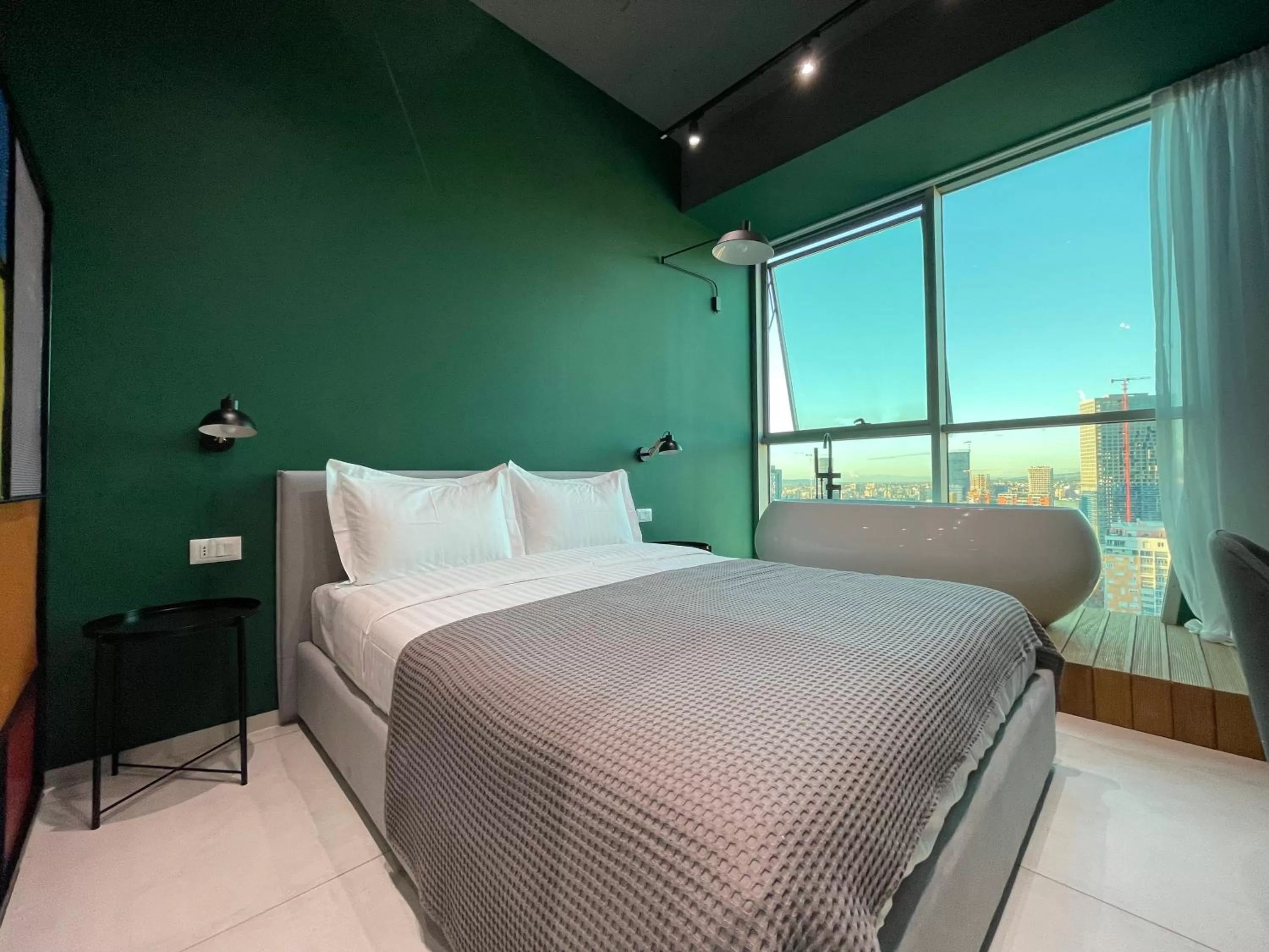 Bed in Ambassador Skyline Apartments