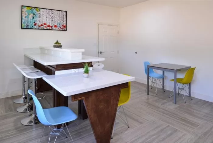 Communal lounge/ TV room in Scottish Inn & Suites - Conroe