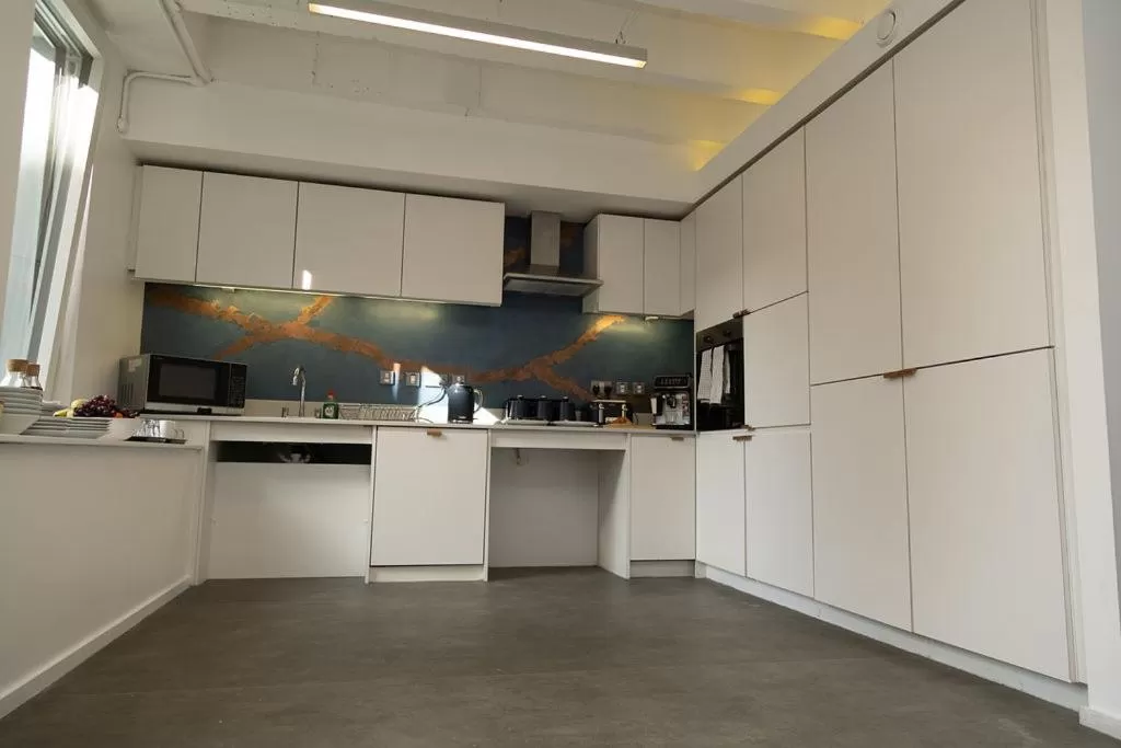 Communal kitchen in Quarter by the Warren Collection