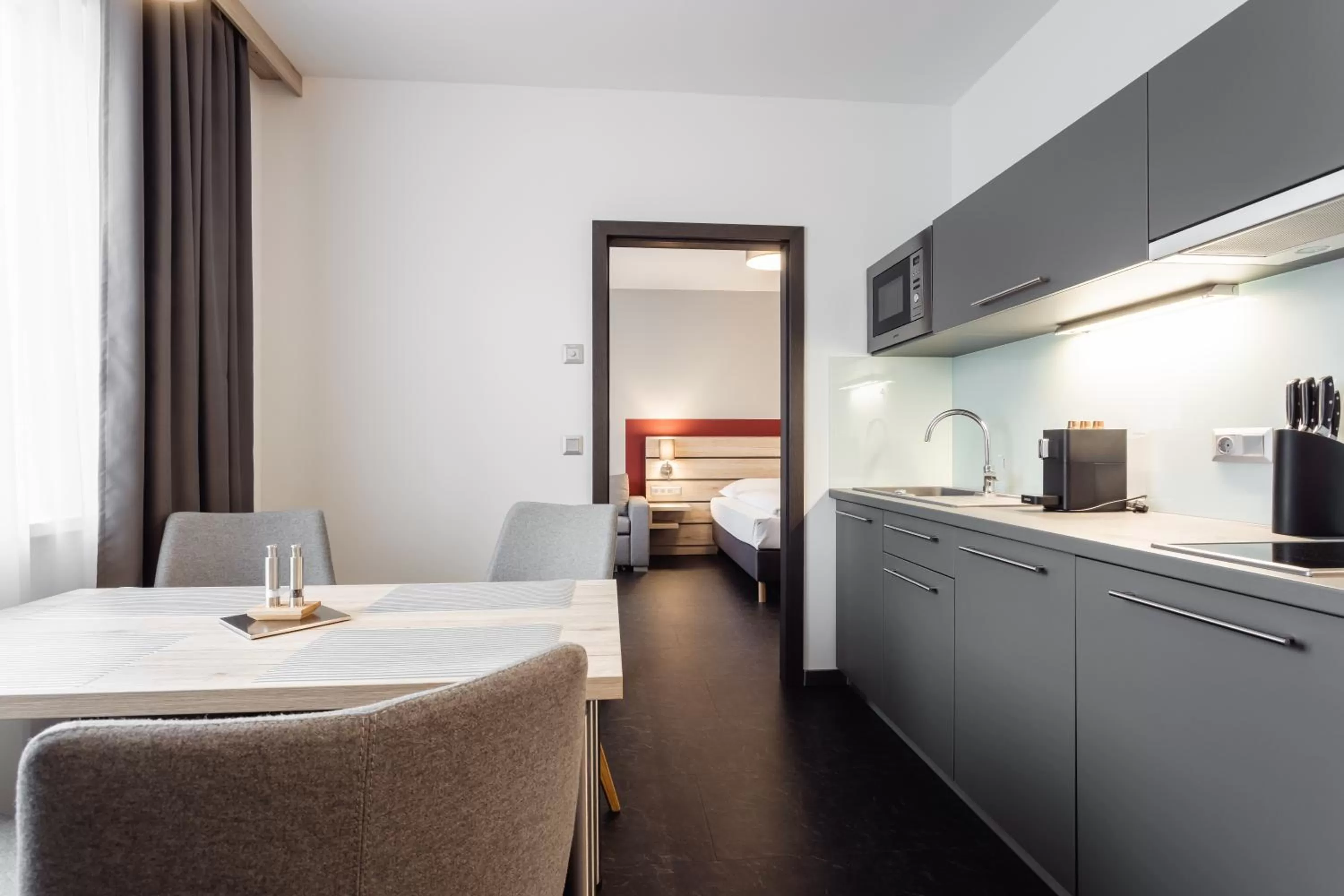 Kitchen or kitchenette, Bed in Hotel Smart Liv'in