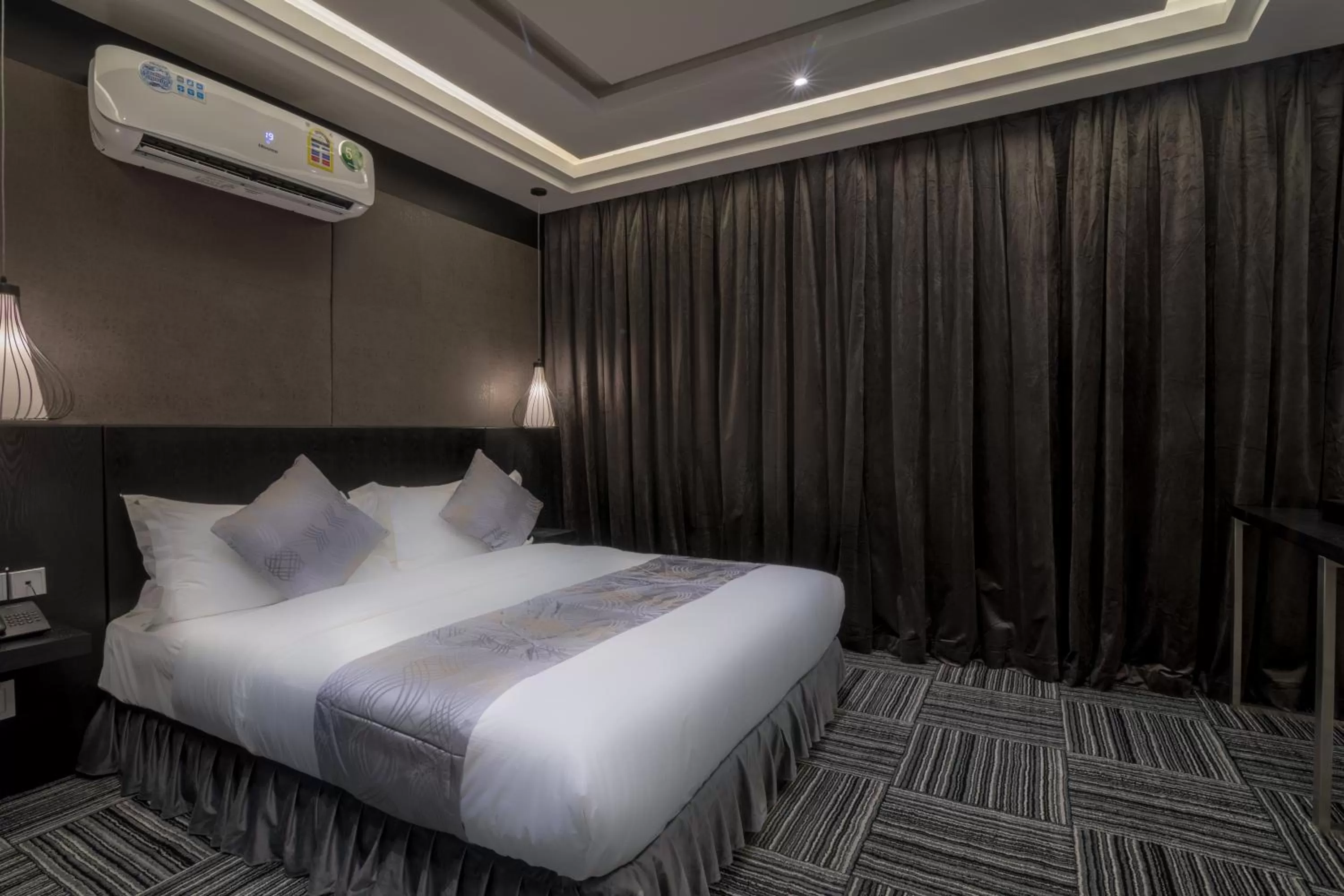 Bed in South Hotel Suites