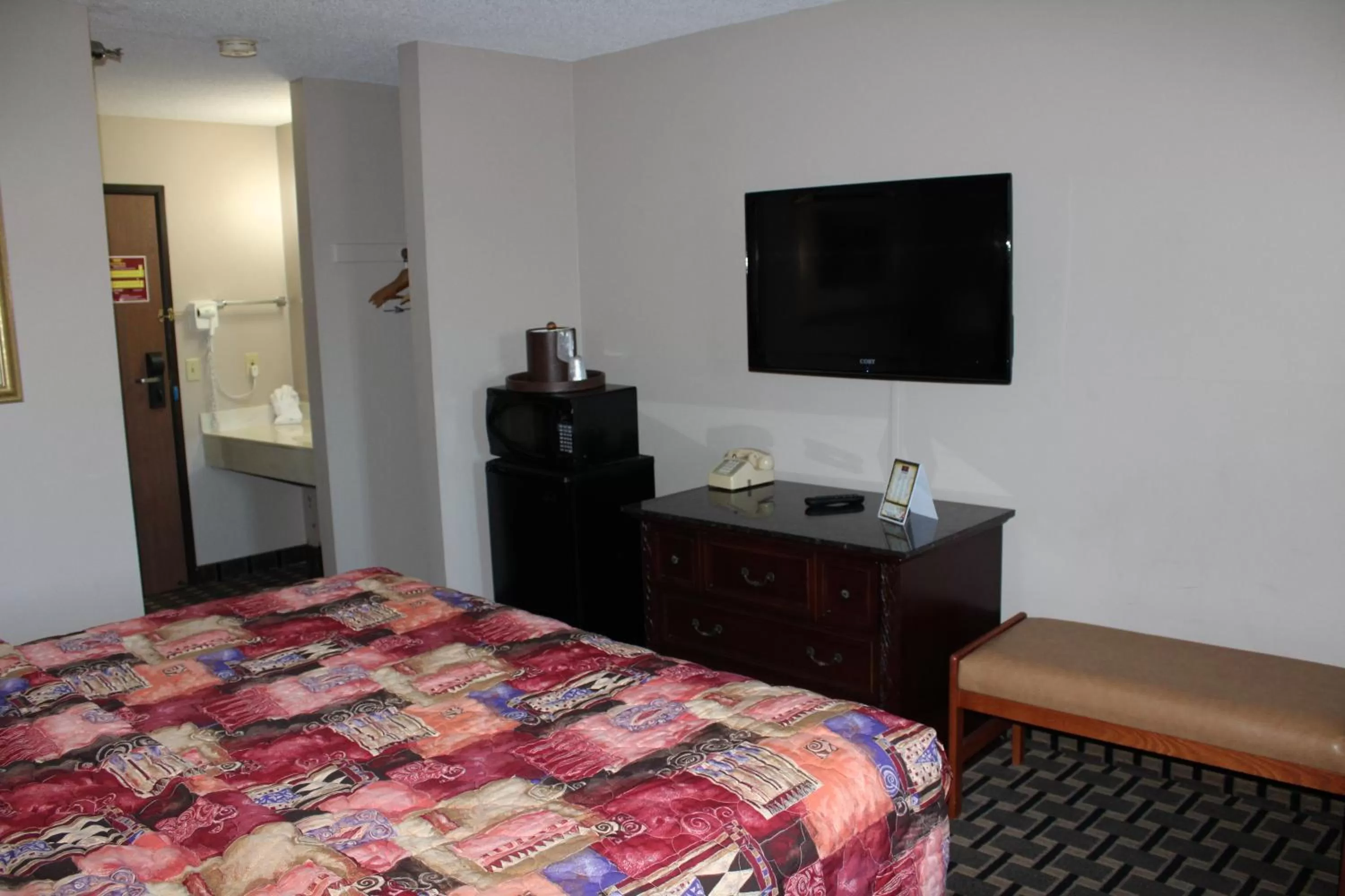 Bedroom, Bed in Coratel Inn and Suites Maple Grove