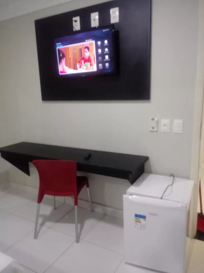 Communal lounge/ TV room in Hotel Executivo Boulevard