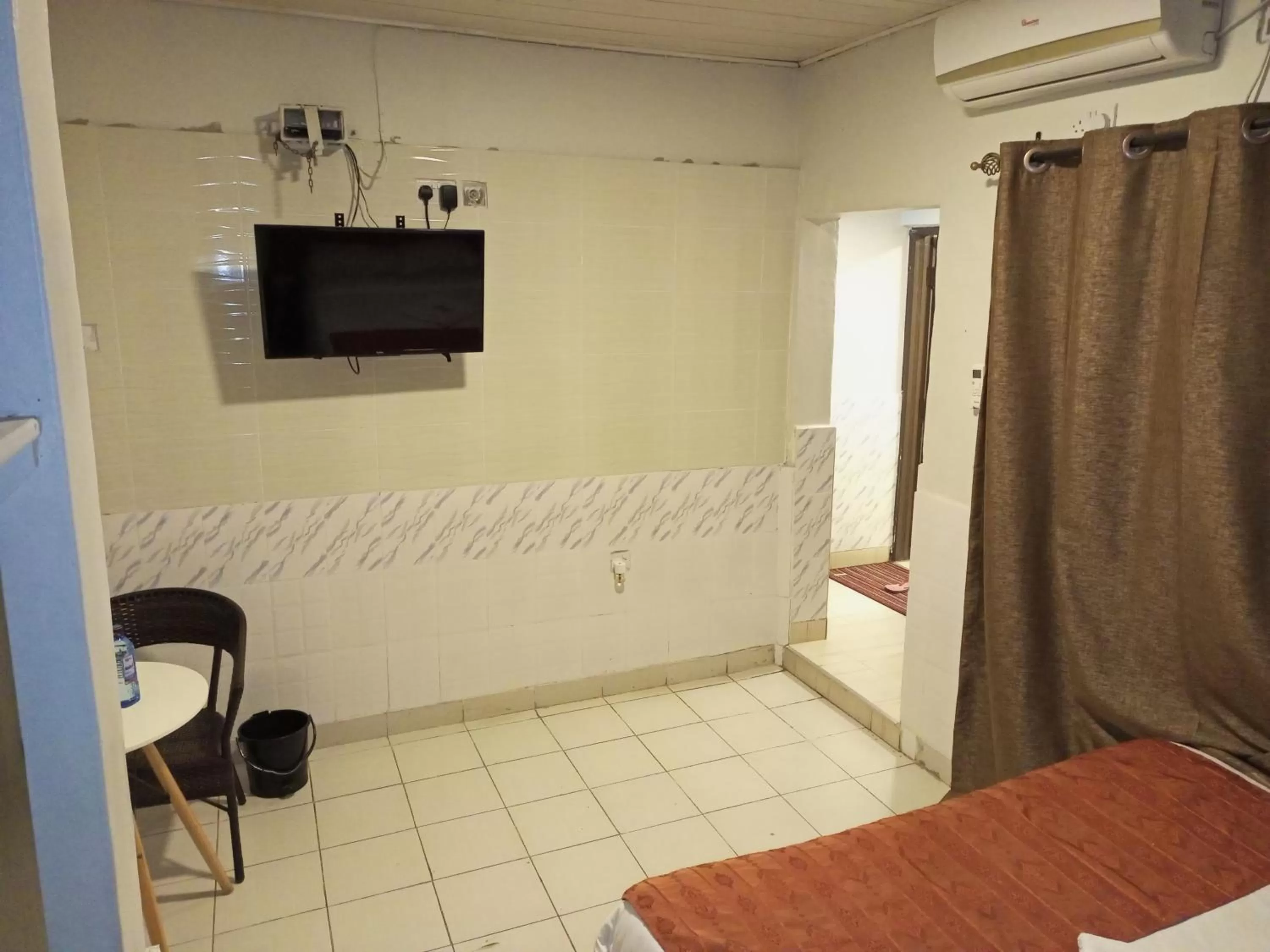 Bedroom, TV/Entertainment Center in Beach View Hotel - Kisumu