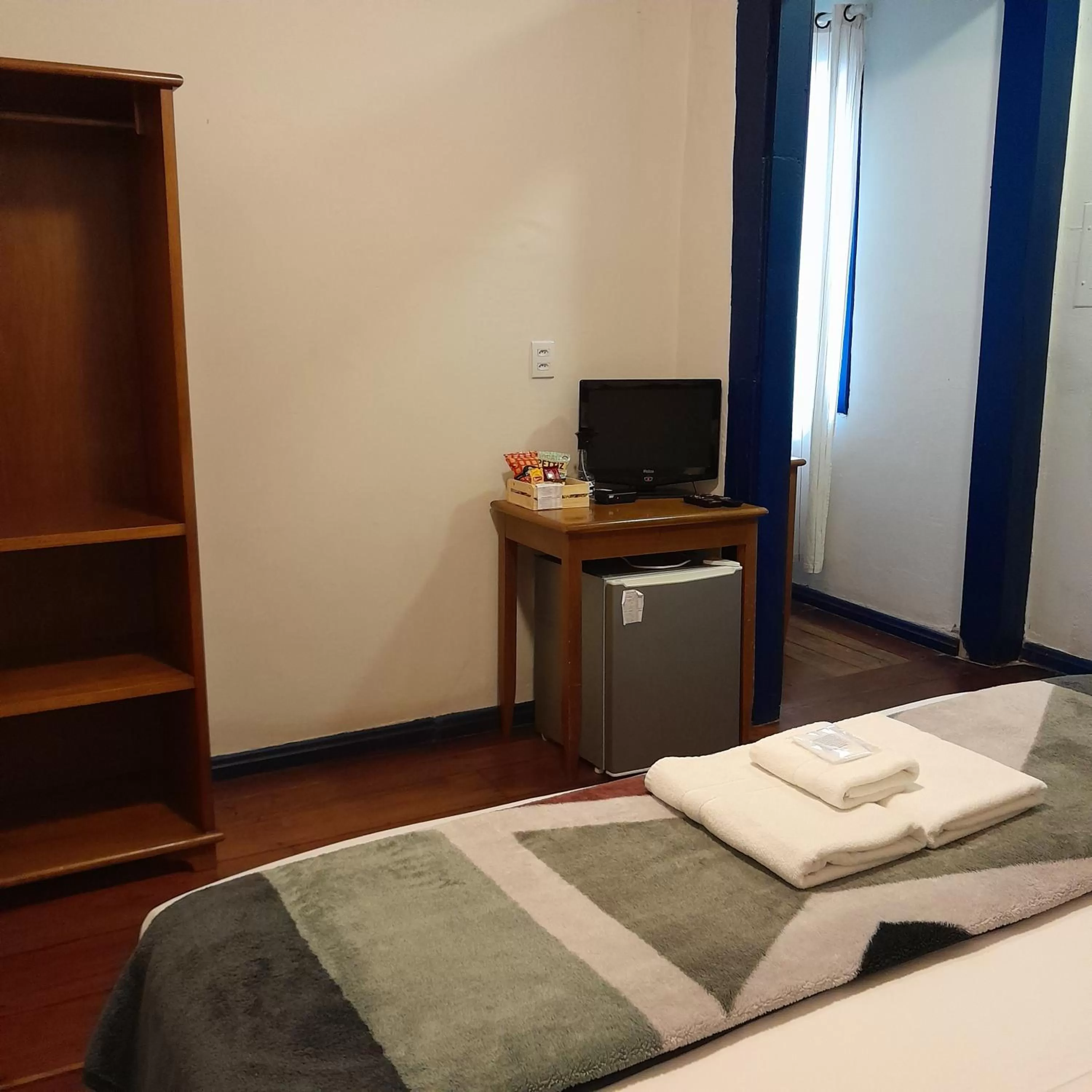 Bed, TV/Entertainment Center in Hotel Barroco Mineiro