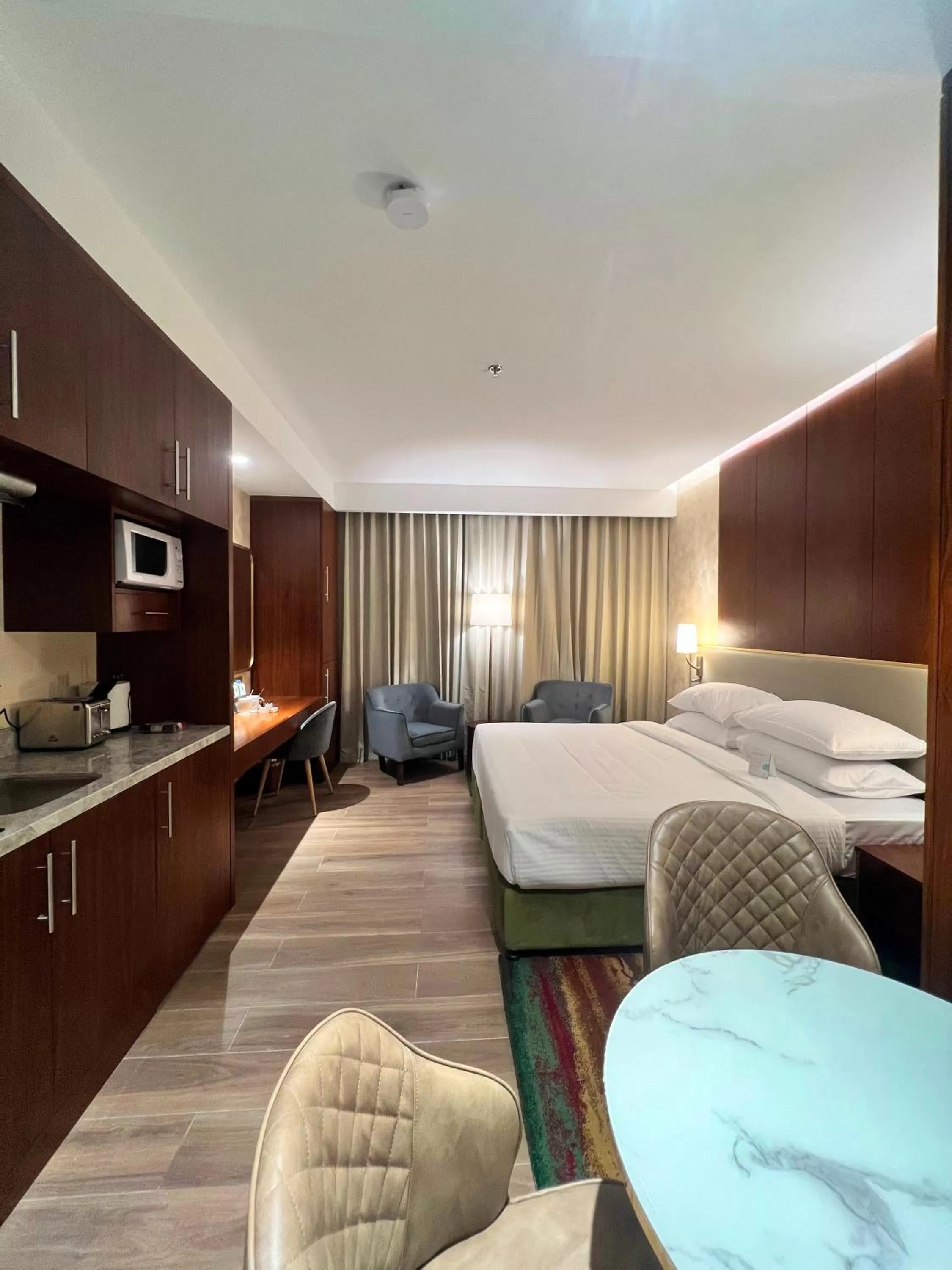 Bedroom, Bed in City Seasons Suites