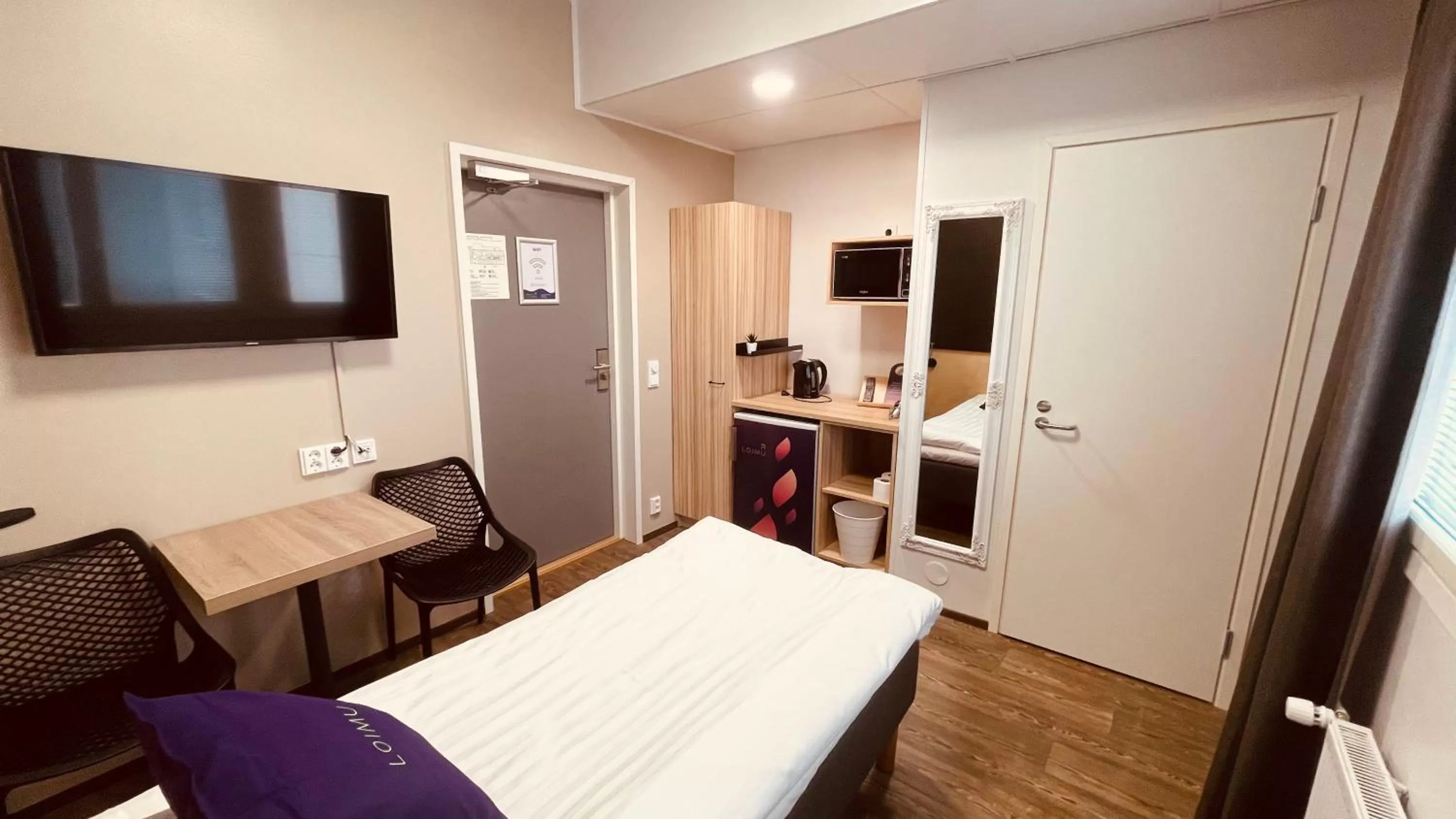 TV and multimedia, Bed in Hotelli Loimu by UHANDA