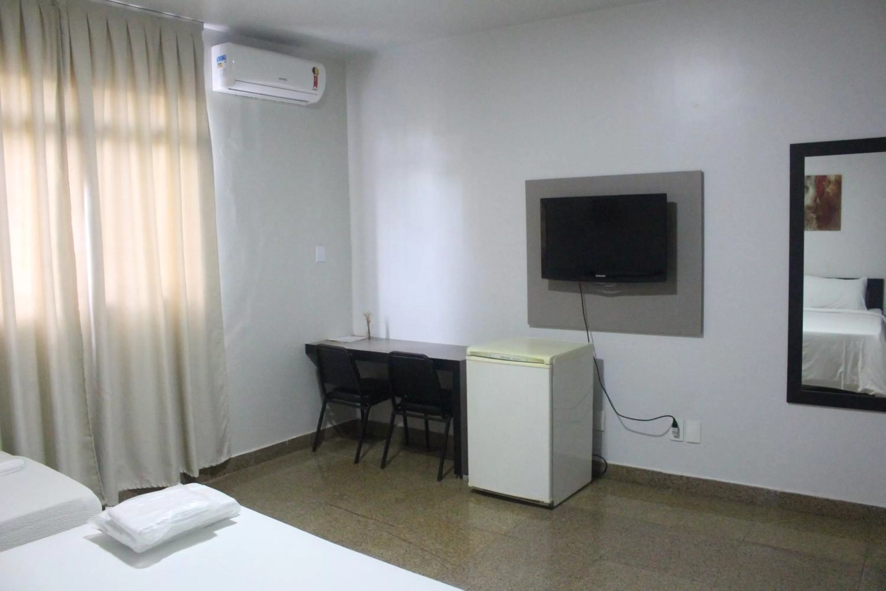 TV/Entertainment Center in Hotel Oscar Blue Montes Claros