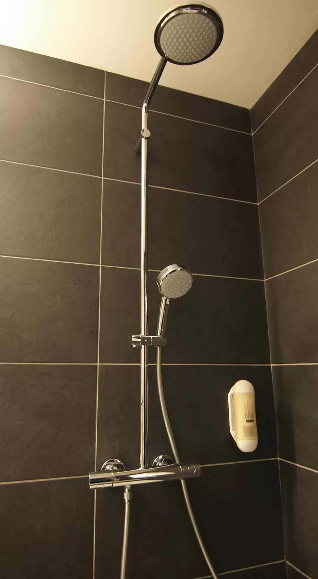 Bathroom in AI Hotel by WMM Hotels